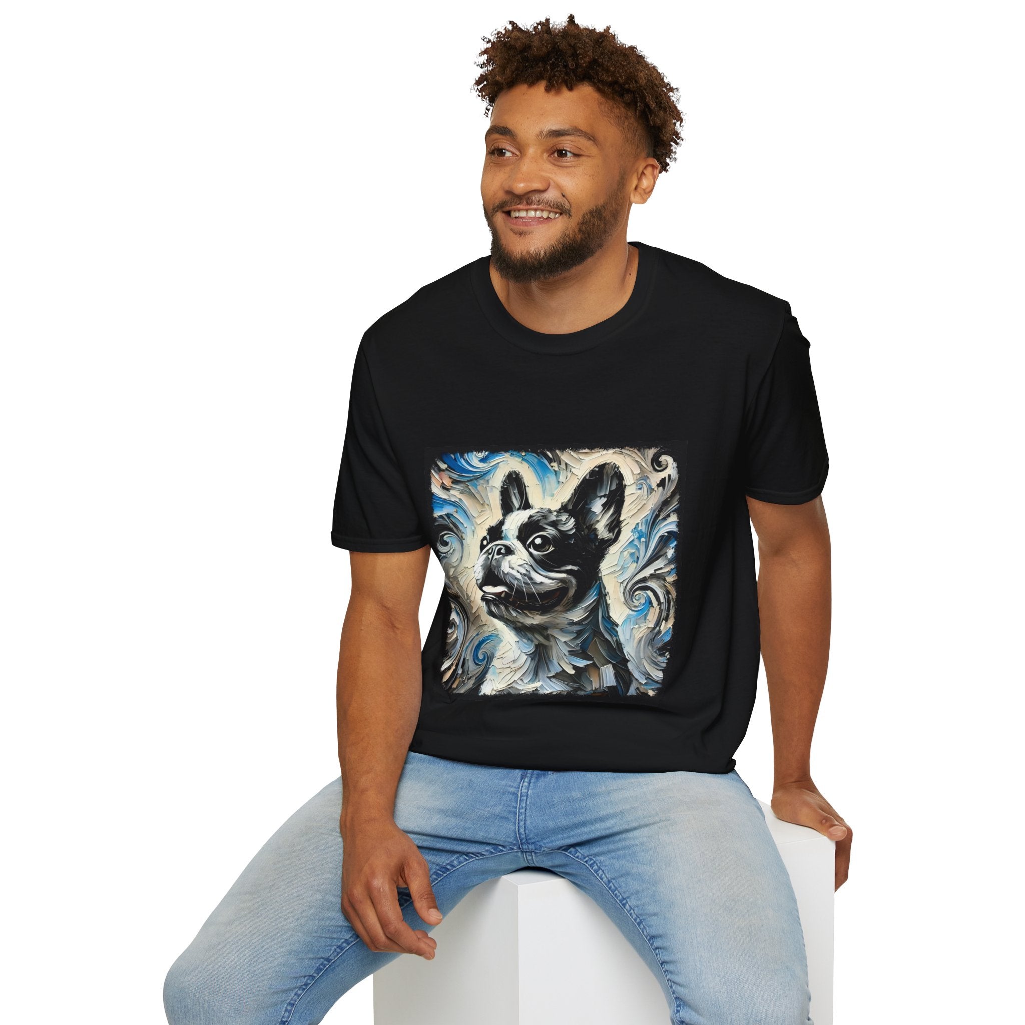 Male model wearing black dog t-shirt with black and white French Bulldog portrait on swirl-patterned vintage background.