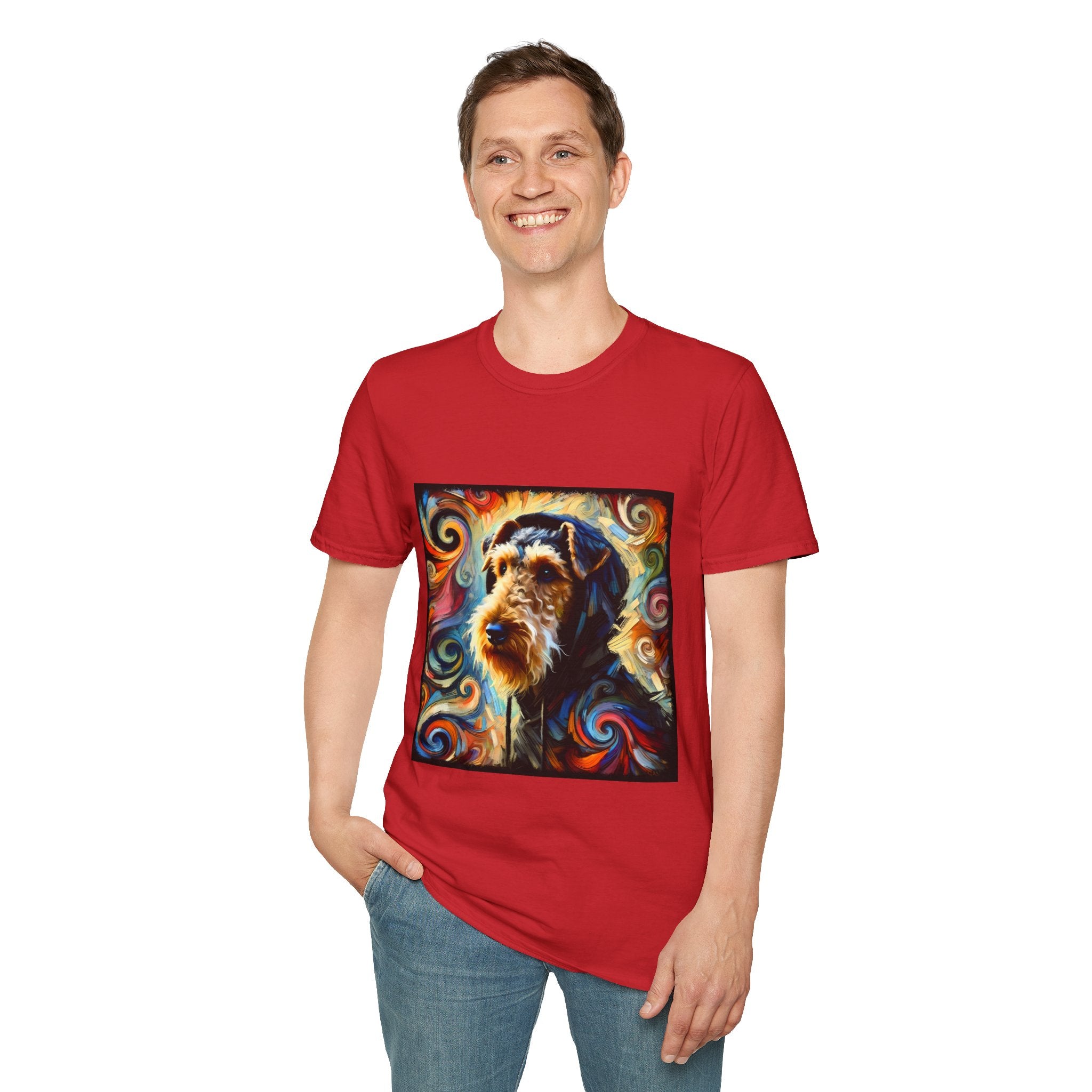 Male standing in red dog t-shirt with Airedale terrier in hoodie and vibrant multicolor swirl background.