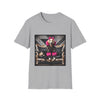 Sport gray dog t-shirt featuring golden retriever with pink bow and fur outfit on black settee in edgy backdrop.