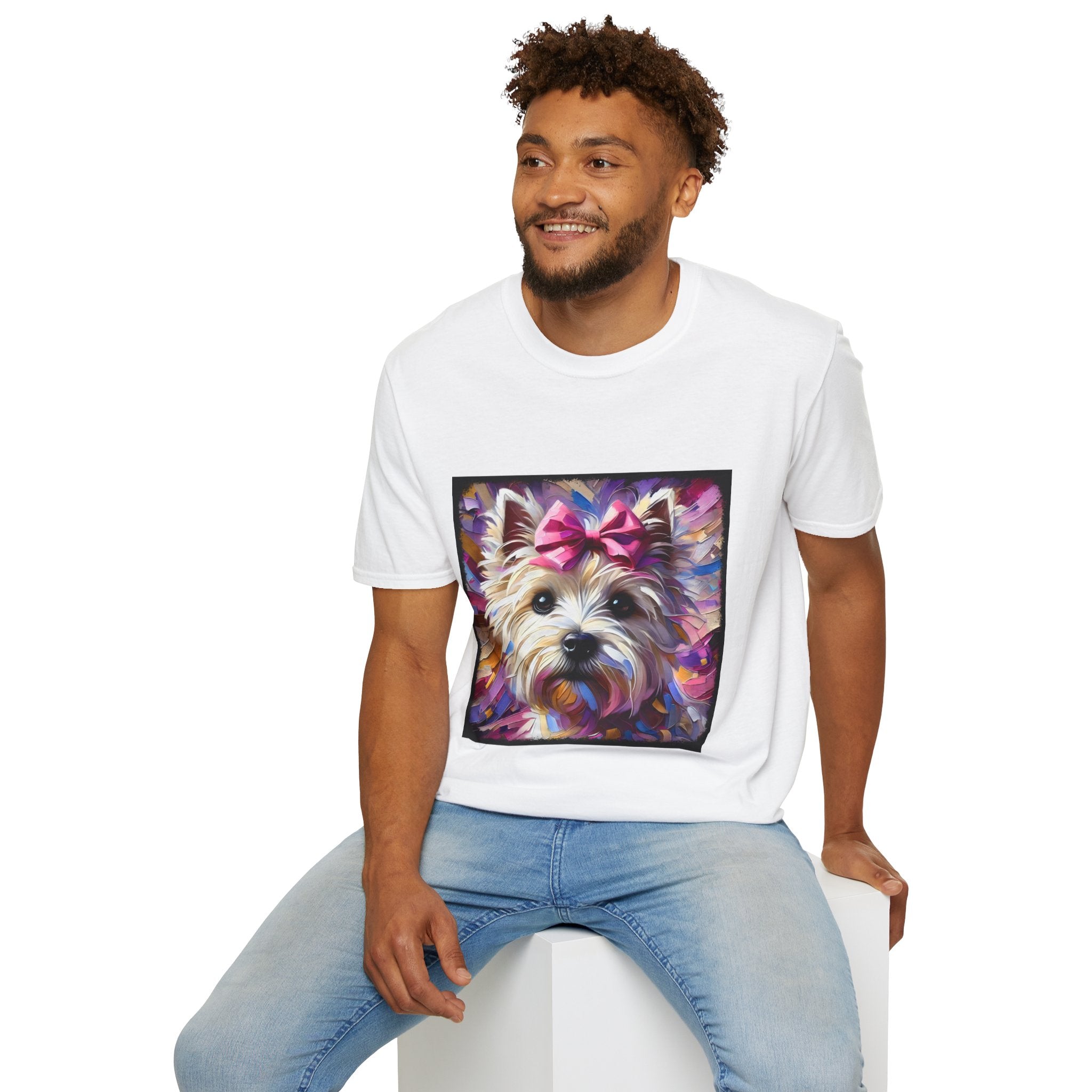Male model in white dog t-shirt with Westie face, pink bow, and bold brushstroke colors in purple, pink, and gold.