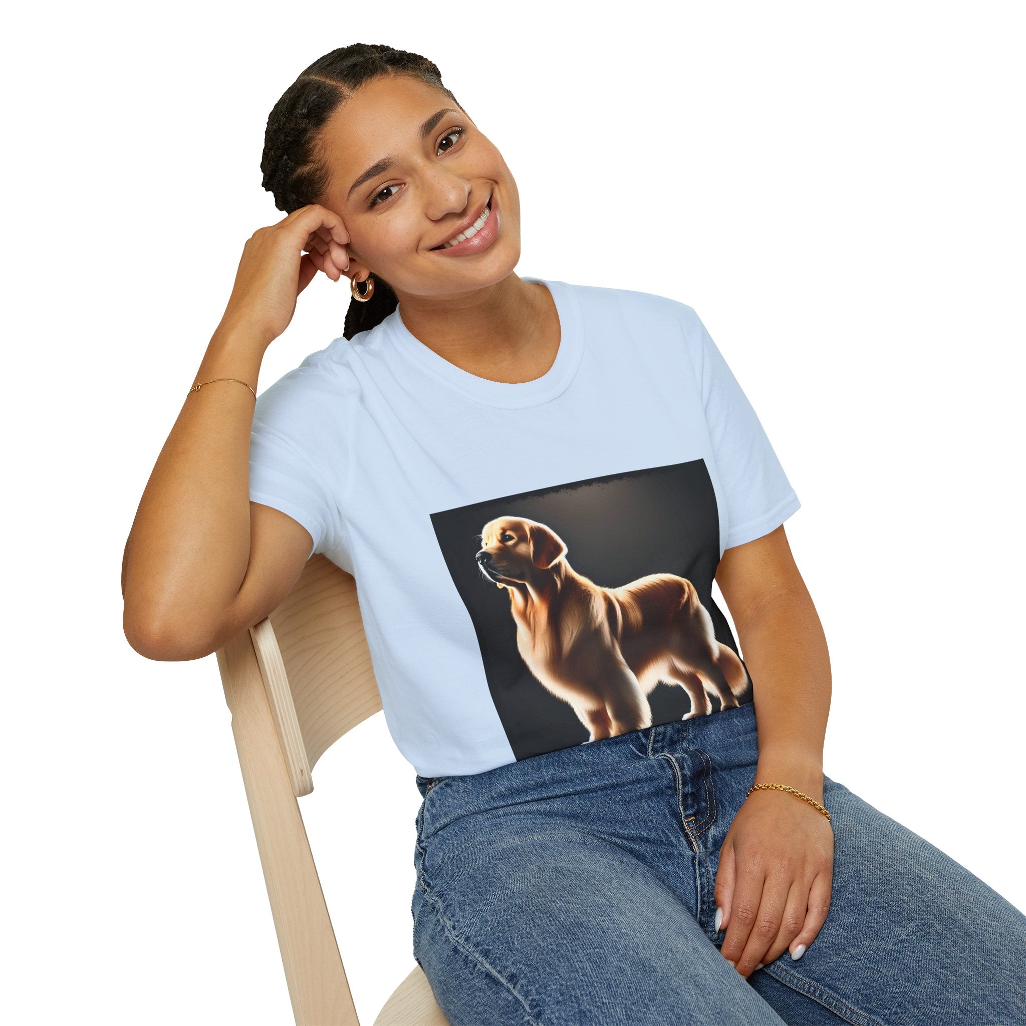 Female model in light blue dog t-shirt with golden retriever standing tall under spotlight on black background.