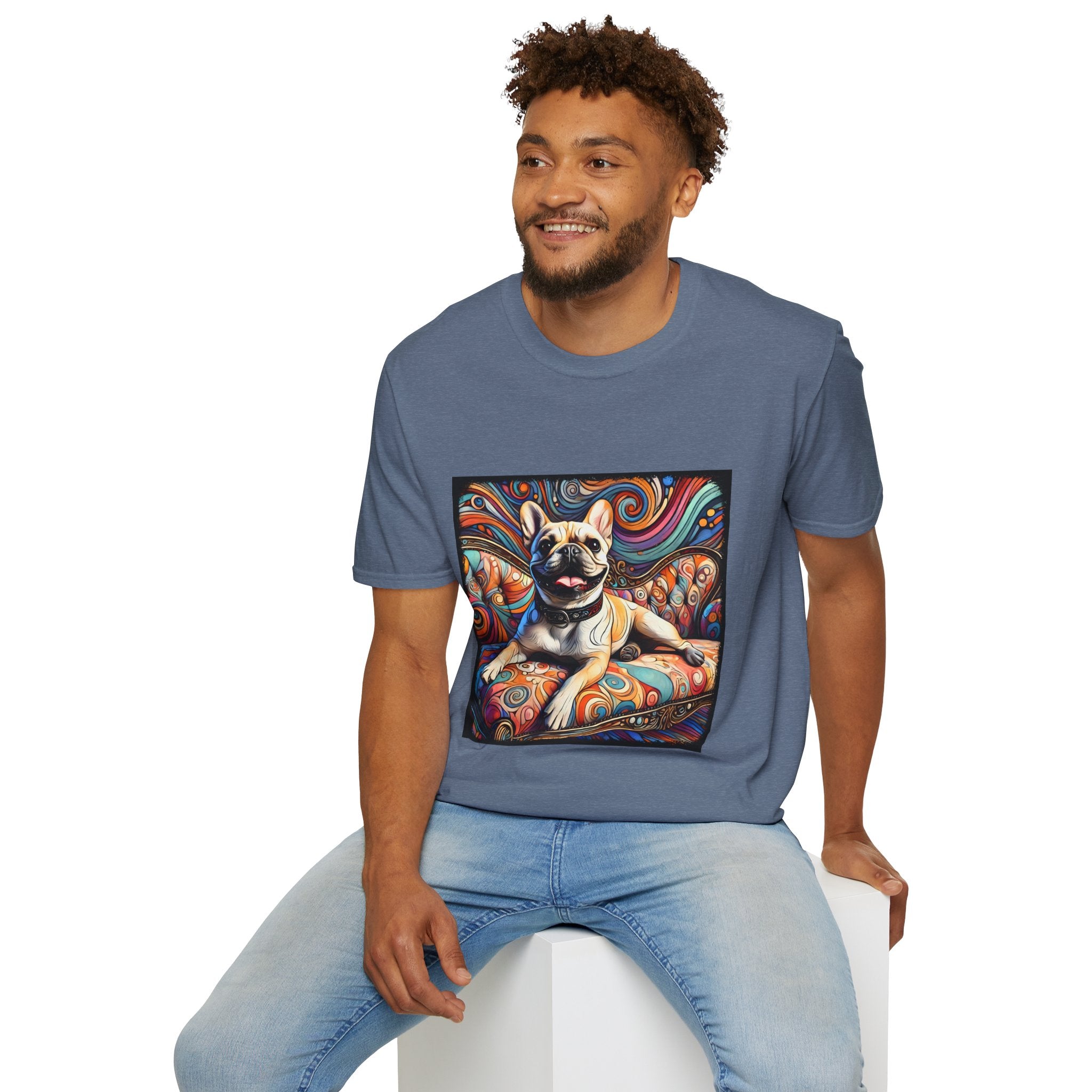 Male model in denim blue dog t-shirt featuring fawn French Bulldog with collar on swirl settee and vivid background.
