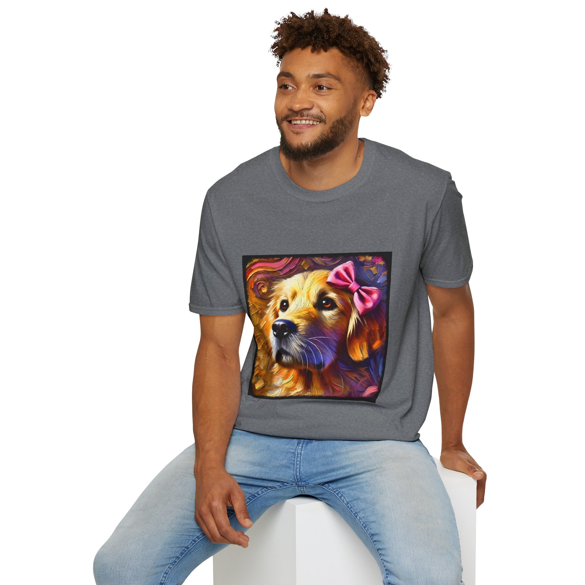 Male model in graphite heather dog t-shirt featuring golden retriever with pink bow on head, set against vivid painterly swirls.