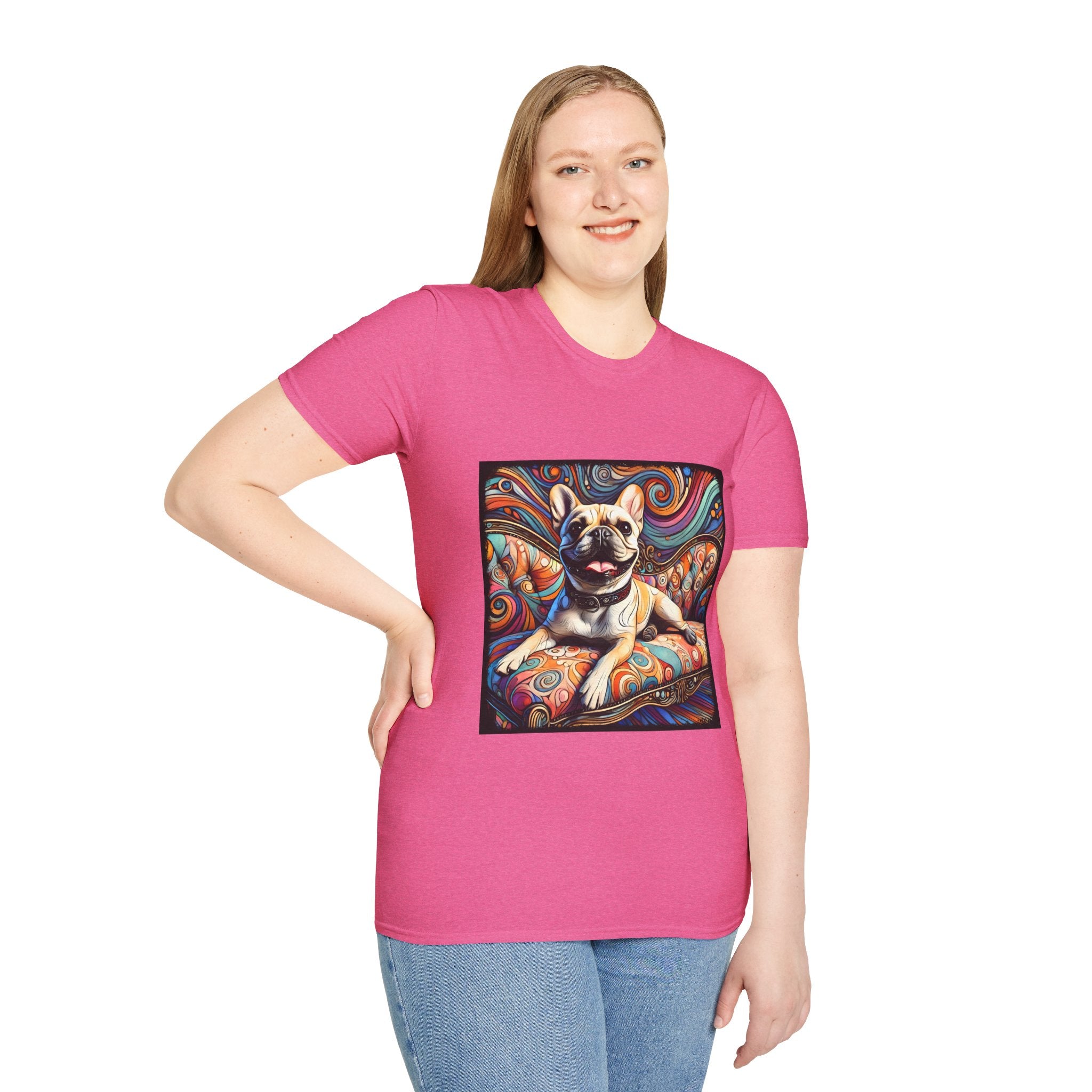 Female model in bold pink dog t-shirt featuring fawn French Bulldog lounging on swirl settee with vivid colorful background.