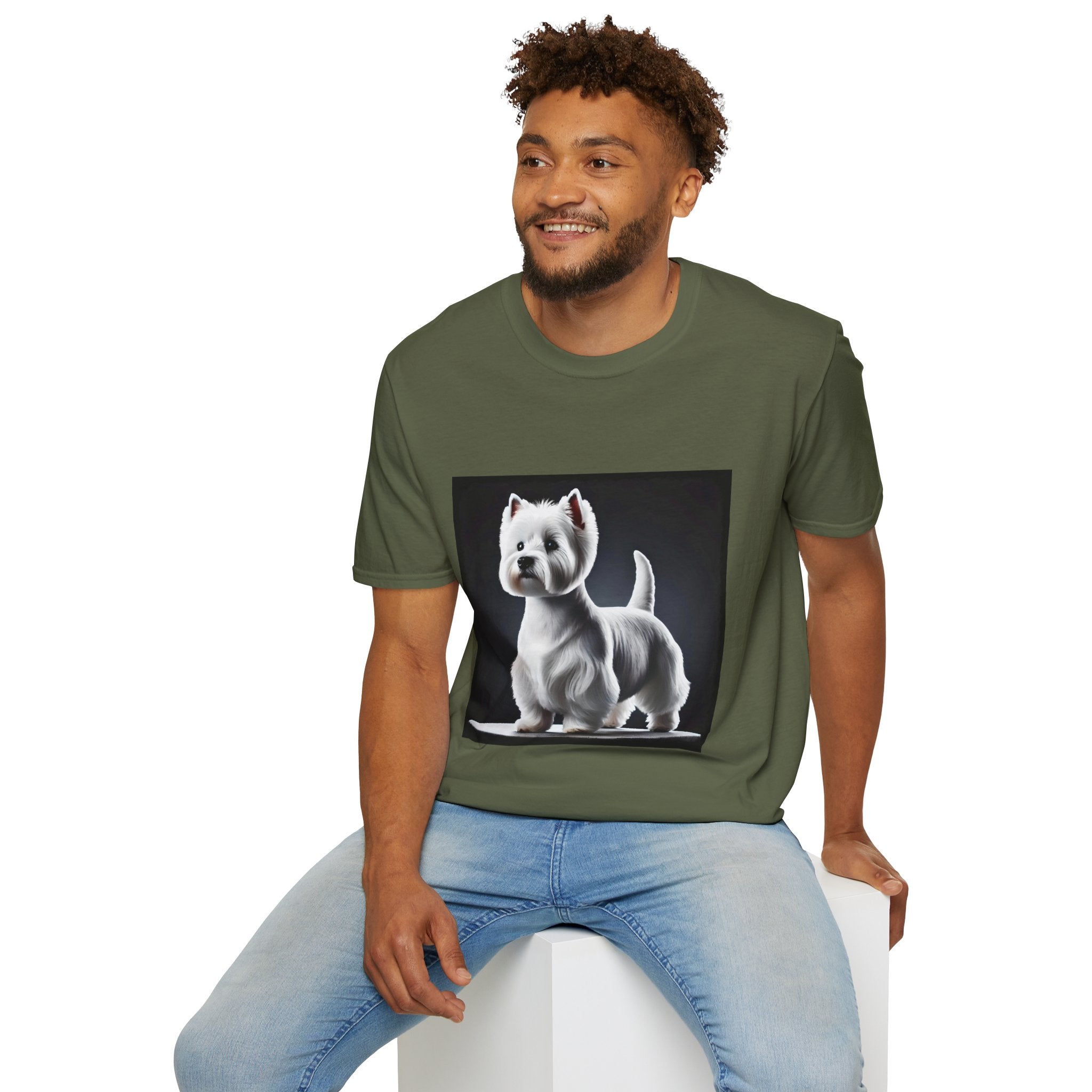 Male model in military green dog t-shirt featuring a Westie standing proud on a platform against a dramatic dark backdrop.