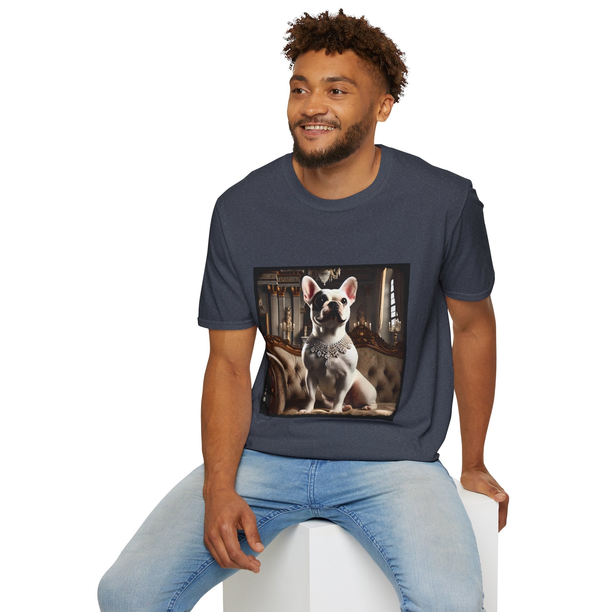 Male model in heather navy dog t-shirt featuring white French Bulldog in jeweled necklace on tufted settee in elegant palace setting.