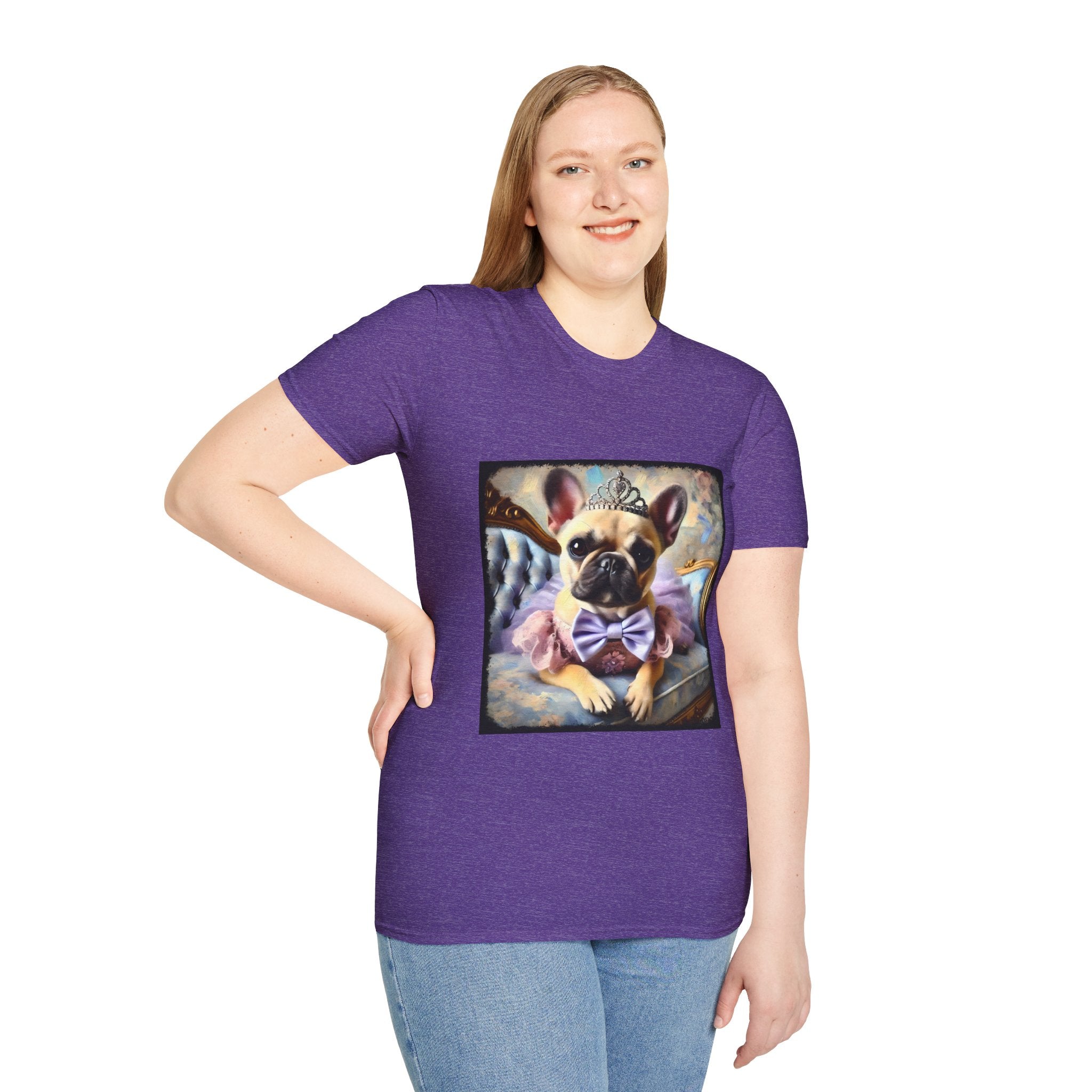 Female model in heather purple dog t-shirt featuring French Bulldog in tiara and tutu on royal chair with dreamy pastel background.