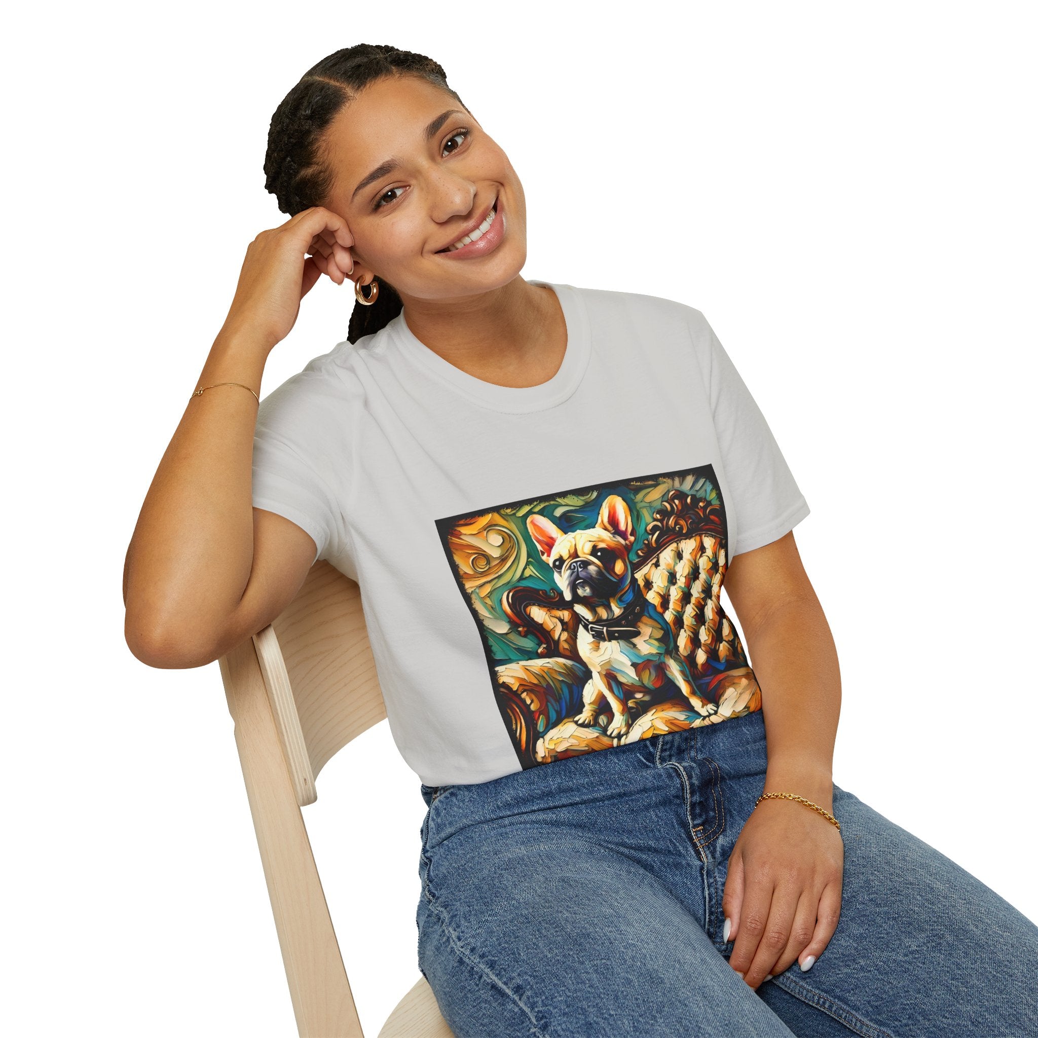Female model in ice gray dog t-shirt featuring fawn French Bulldog with collar on golden tufted settee and bold swirl backdrop.