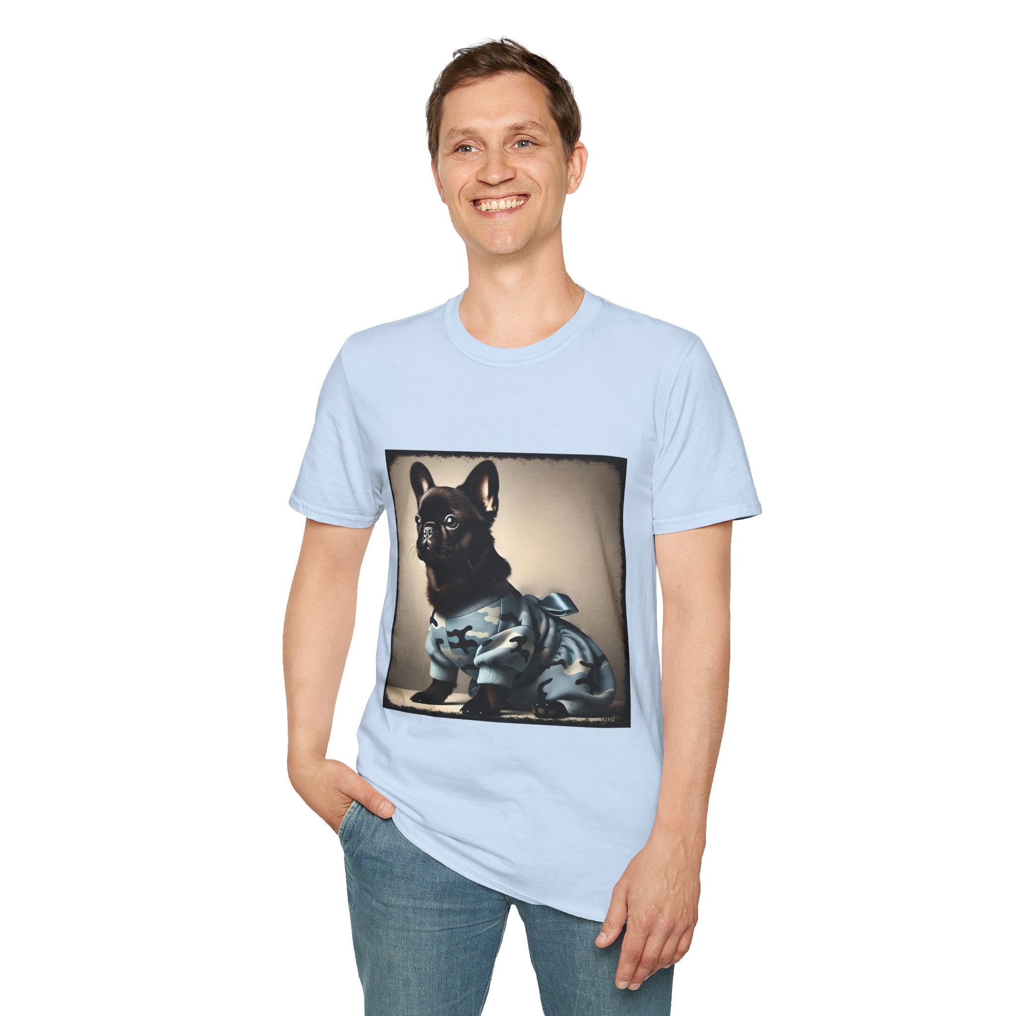 Man smiling wearing light blue dog t-shirt featuring black French Bulldog in blue camo outfit with bow, set in soft vintage portrait.