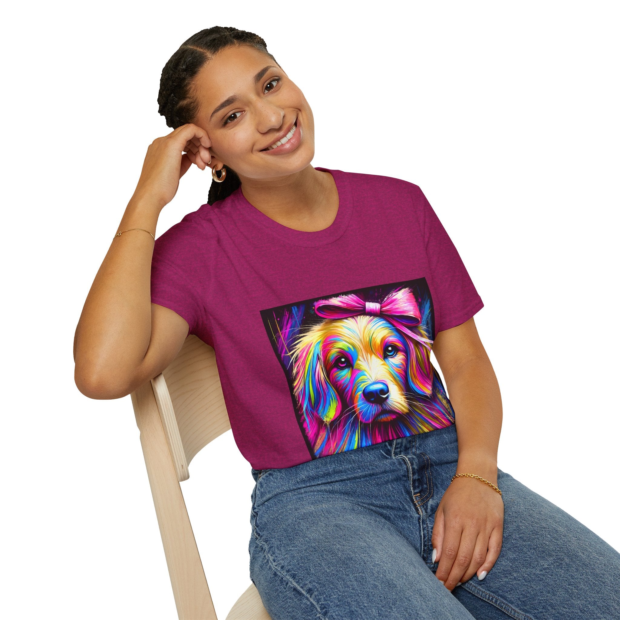Female model in heather berry dog t-shirt featuring neon-colored golden retriever with pink bow on vibrant electric abstract backdrop.
