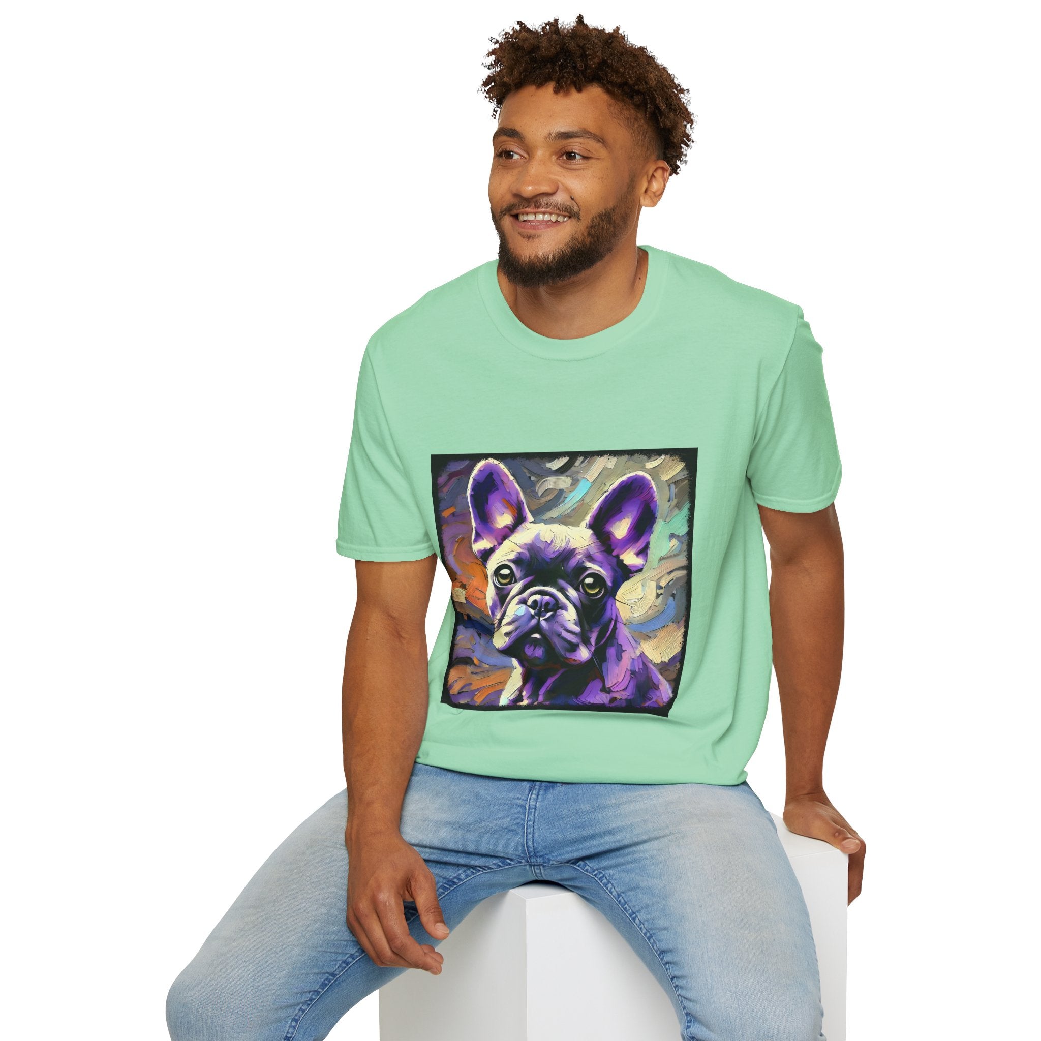 Male model in mint green dog t-shirt featuring a lavender purple French Bulldog with swirling brushstrokes of teal, orange, and cream.