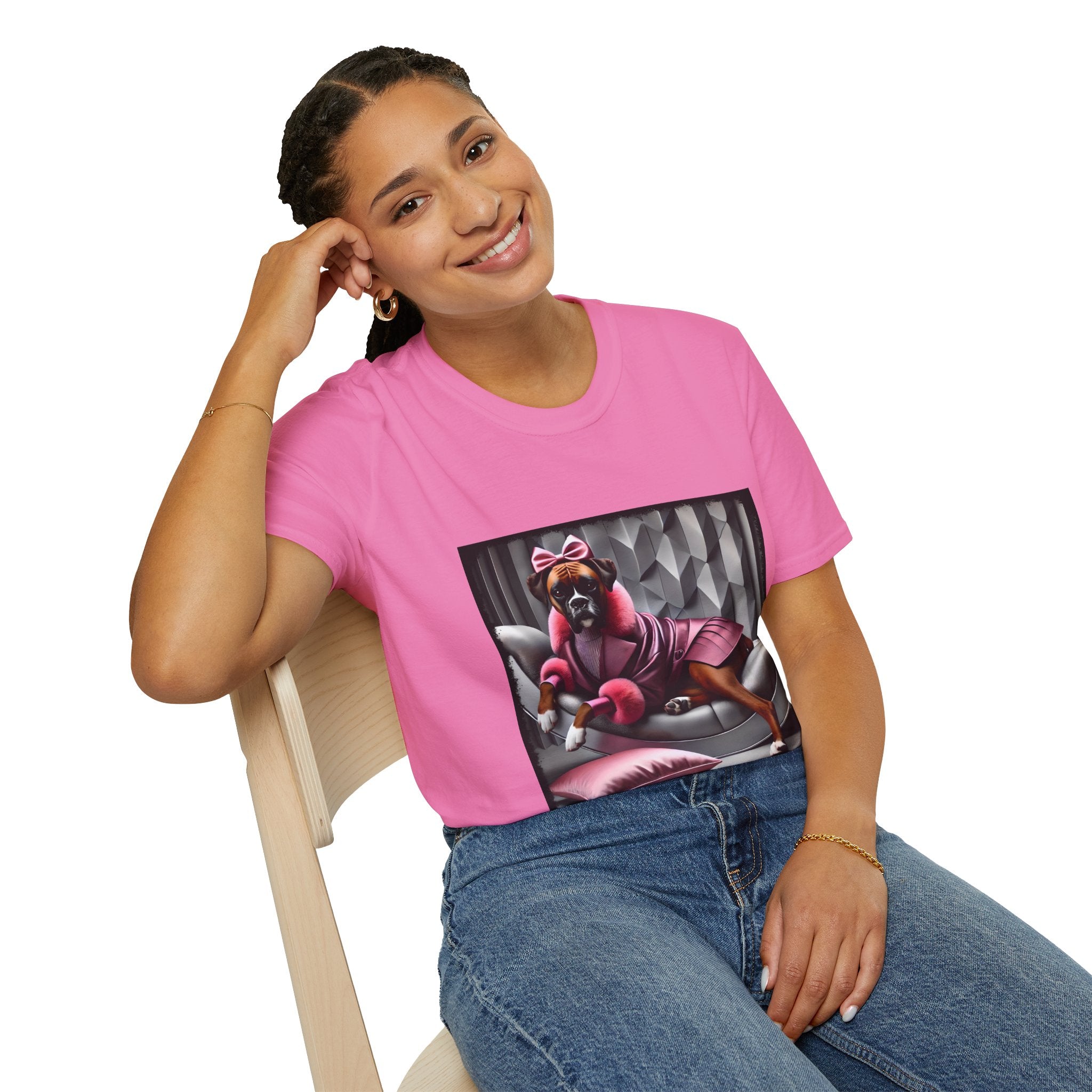 Female model in pink dog t-shirt featuring boxer in pink bow and pleated pink coat lounging on silver settee.