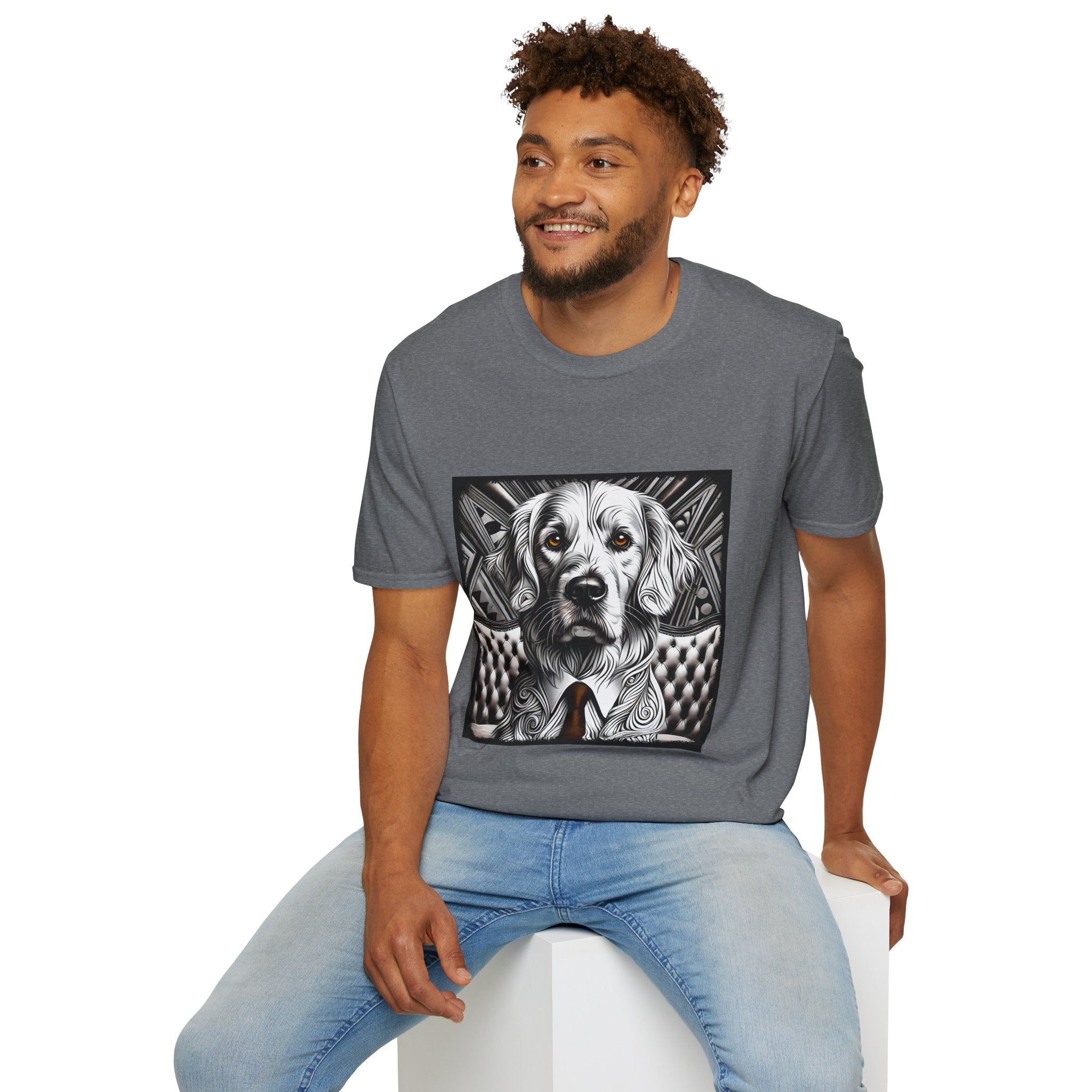 Male model in graphite heather dog t-shirt featuring monochrome golden retriever with brown eyes and tie in front of settee.