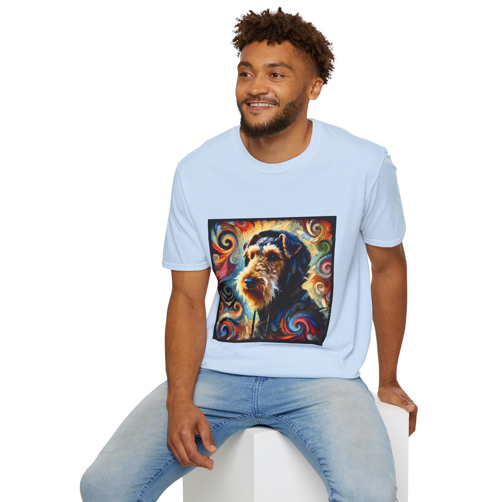Male model in light blue dog t-shirt with Airedale terrier in hoodie and vibrant multicolor swirl background.