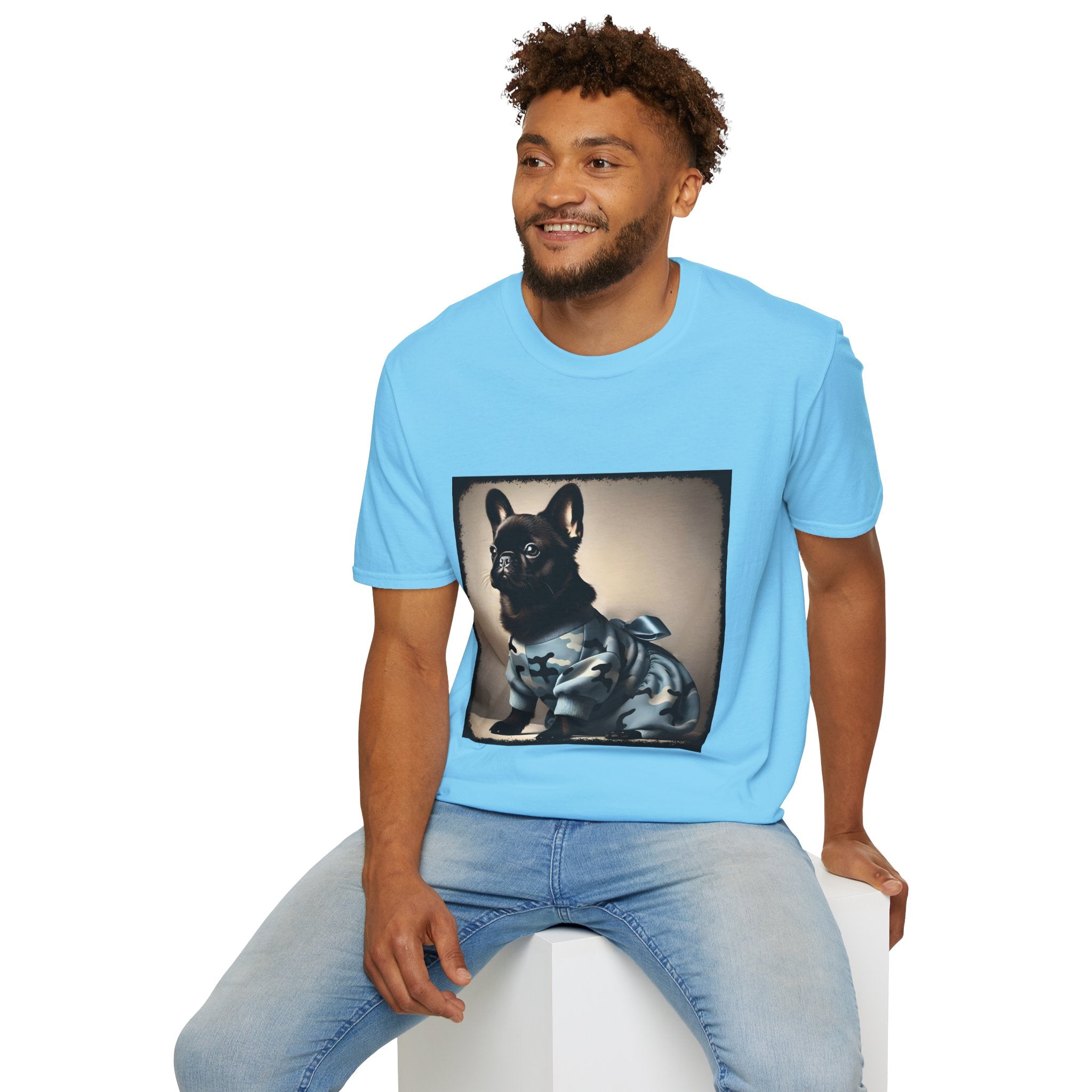 Male model wearing sky blue dog t-shirt featuring black French Bulldog in blue camo outfit with bow, set in soft vintage portrait.
