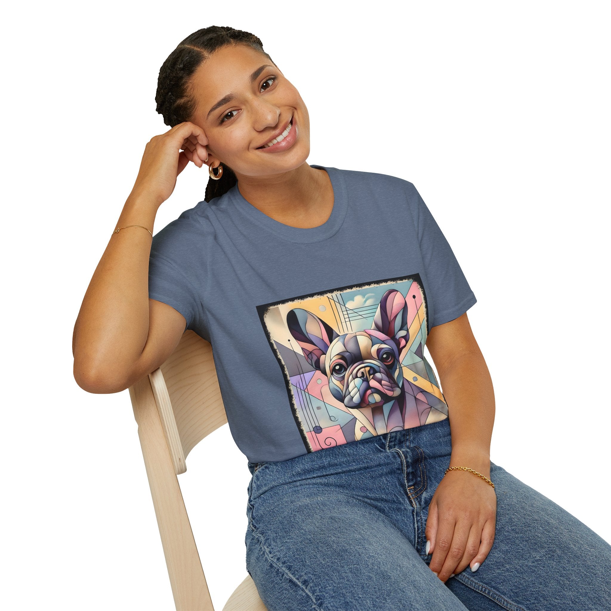 Woman sitting in heather indigo shirt with Cubism-style French Bulldog design in soft pastel colors and abstract shapes.