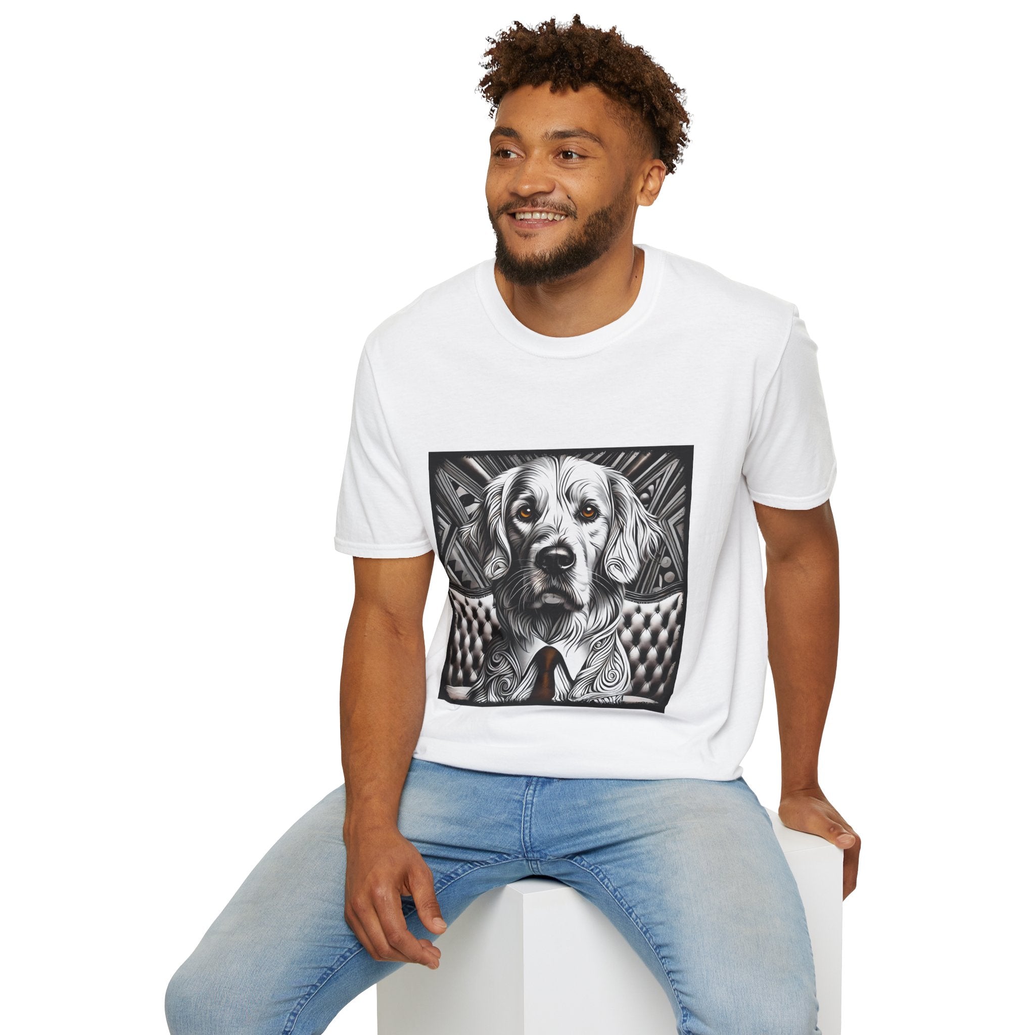Male model in white dog t-shirt featuring monochrome golden retriever with brown eyes and tie in front of settee.
