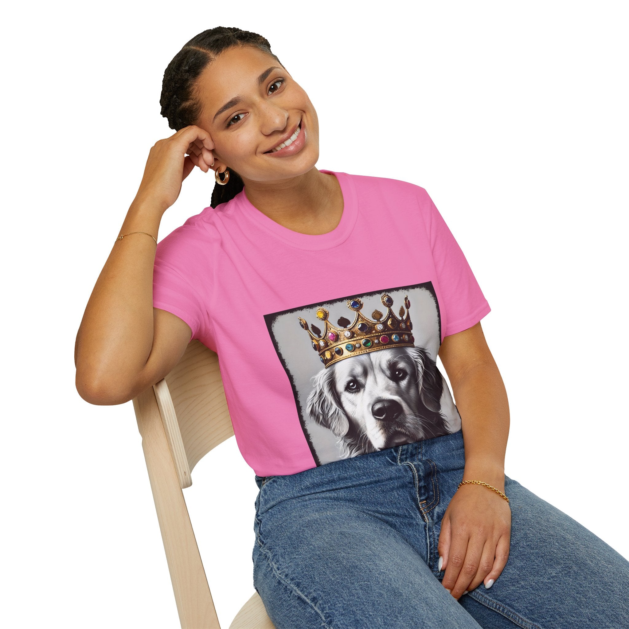 Female model in pink dog t-shirt featuring a black-and-white golden retriever in jeweled crown on gray backdrop.