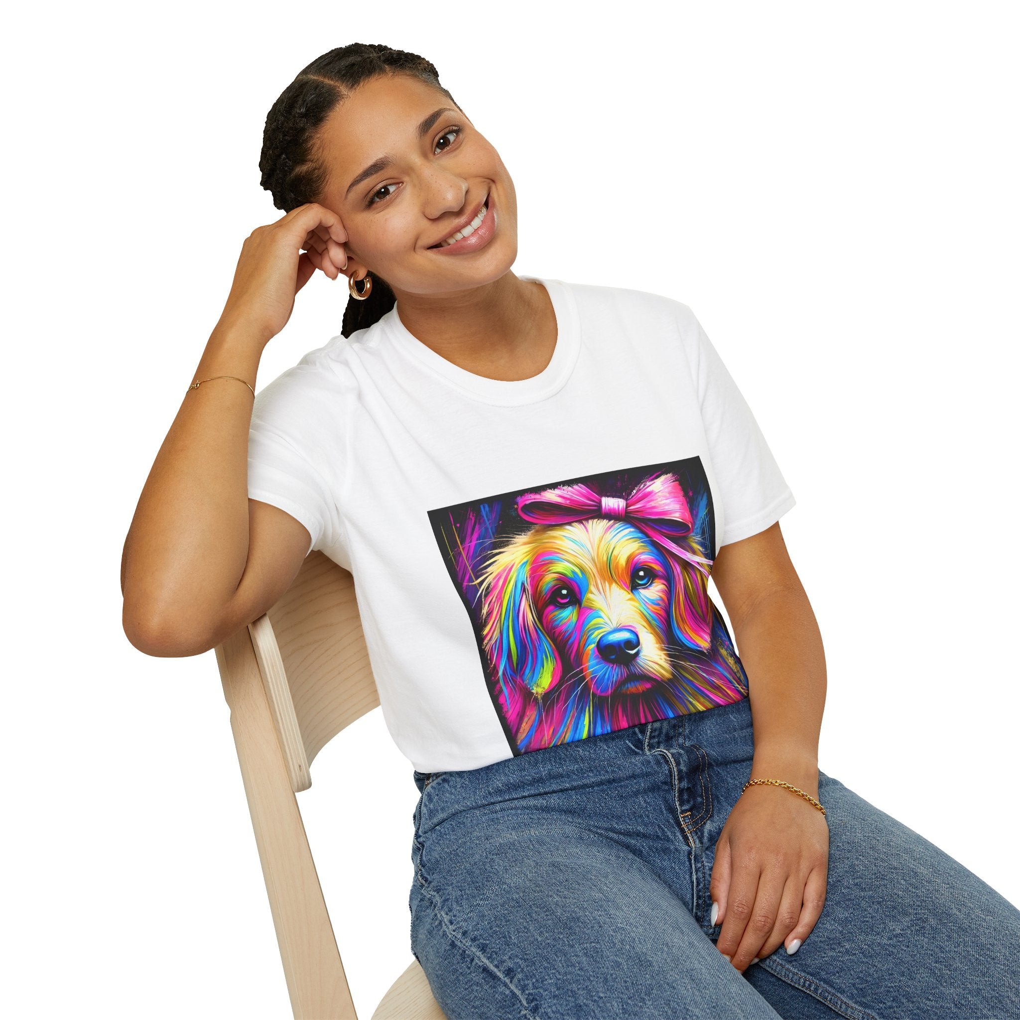 Female model in white dog t-shirt featuring neon-colored golden retriever with pink bow on vibrant electric abstract backdrop.