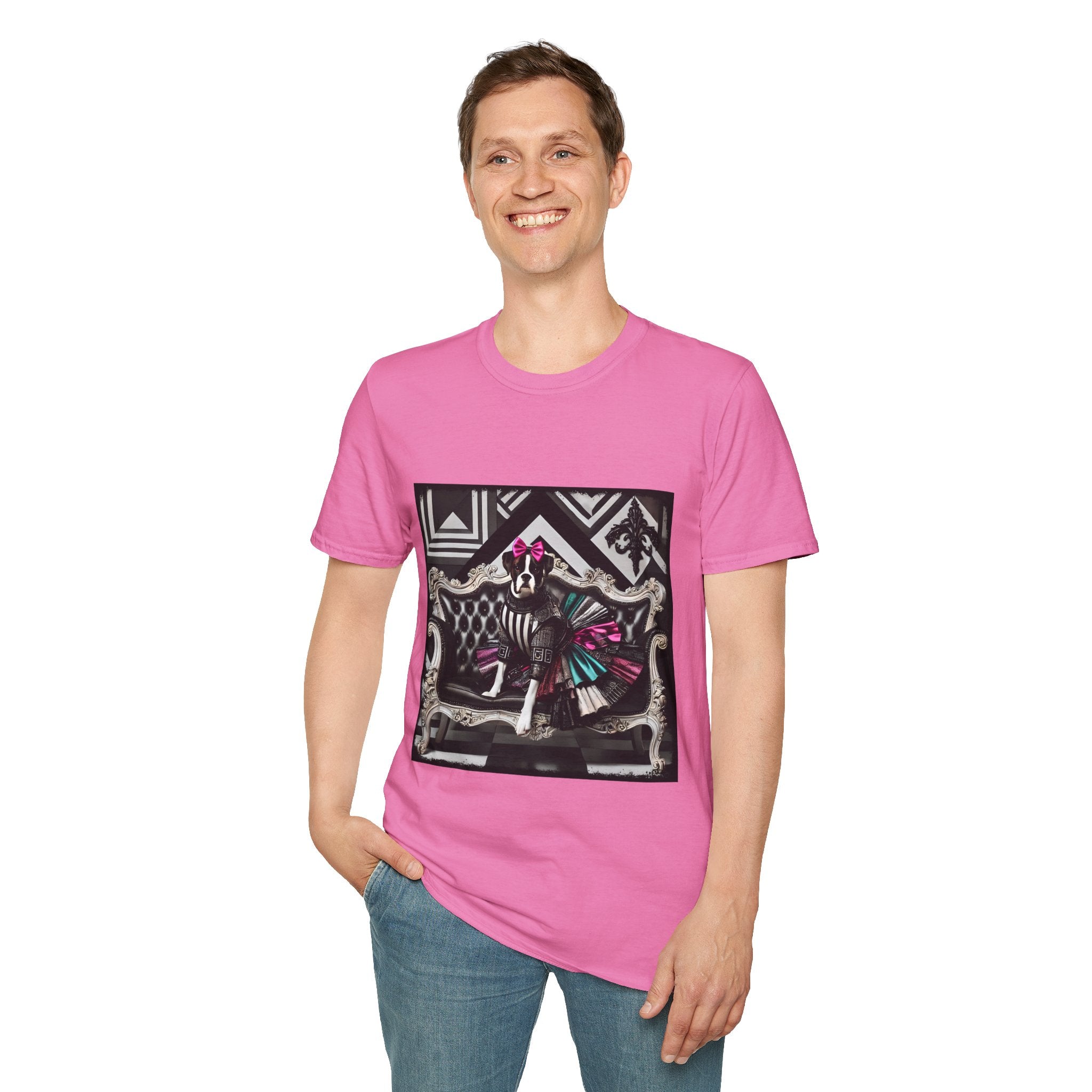 Male model in pink dog t-shirt with black and white boxer in pink bow and varsity dress in pleated skirt, bold geometric black backdrop.