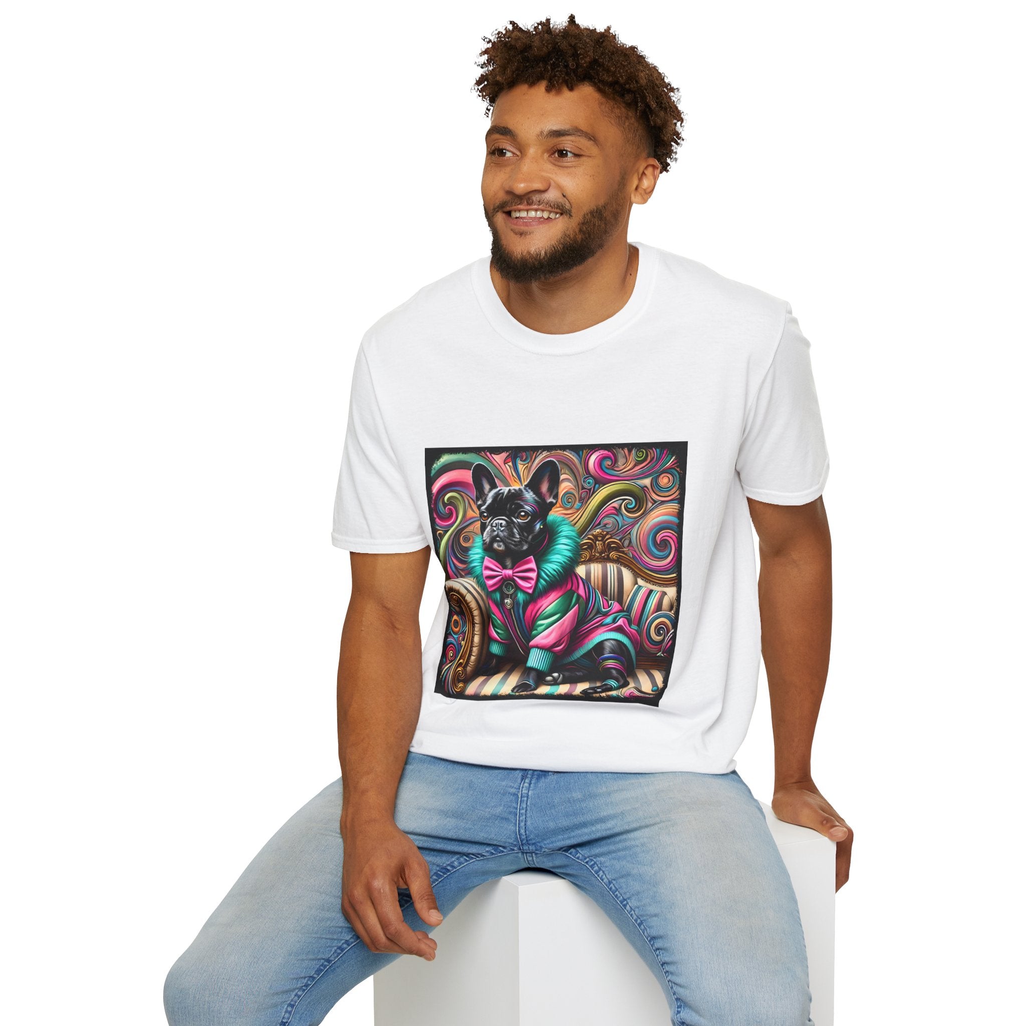 Male model  in white dog t-shirt with black French Bulldog in pink and teal outfit on swirl background and settee.