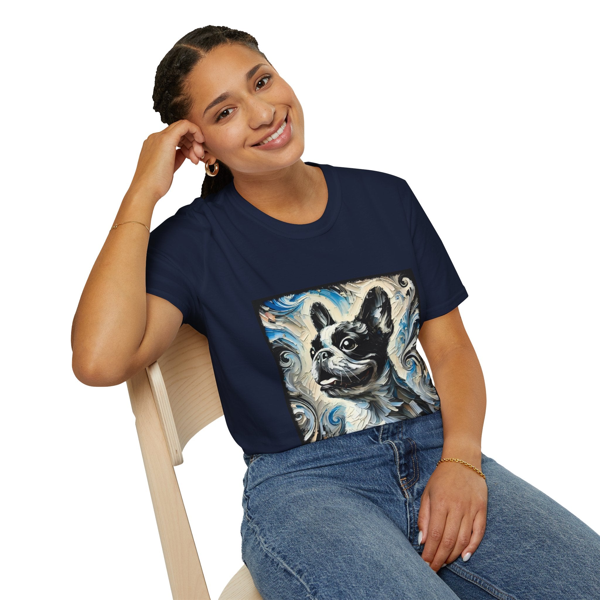 Woman sitting in navy blue dog t-shirt featuring black and white French Bulldog portrait on swirl-patterned background.