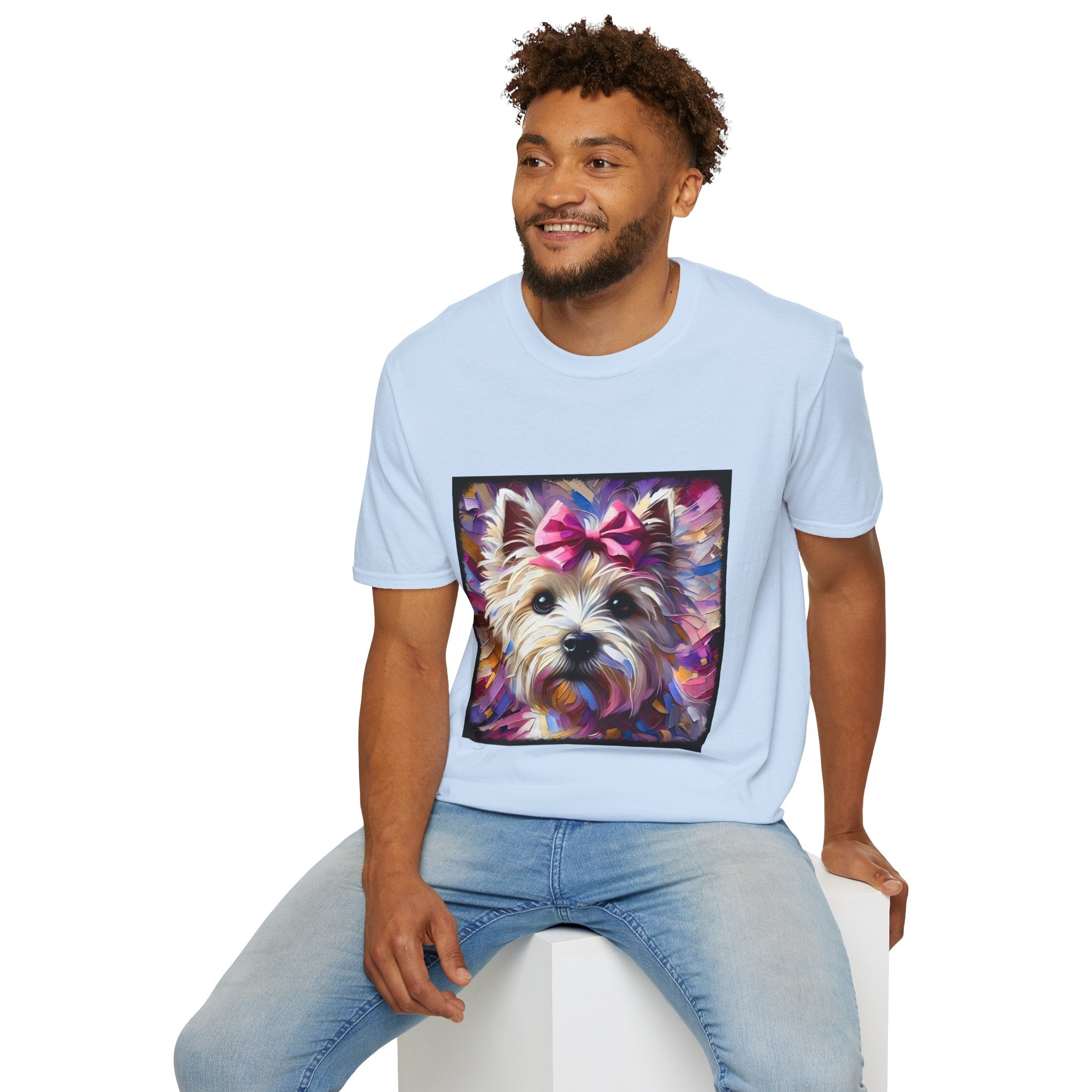 Male model in light blue dog t-shirt with Westie face, pink bow, and bold brushstroke colors in purple, pink, and gold.