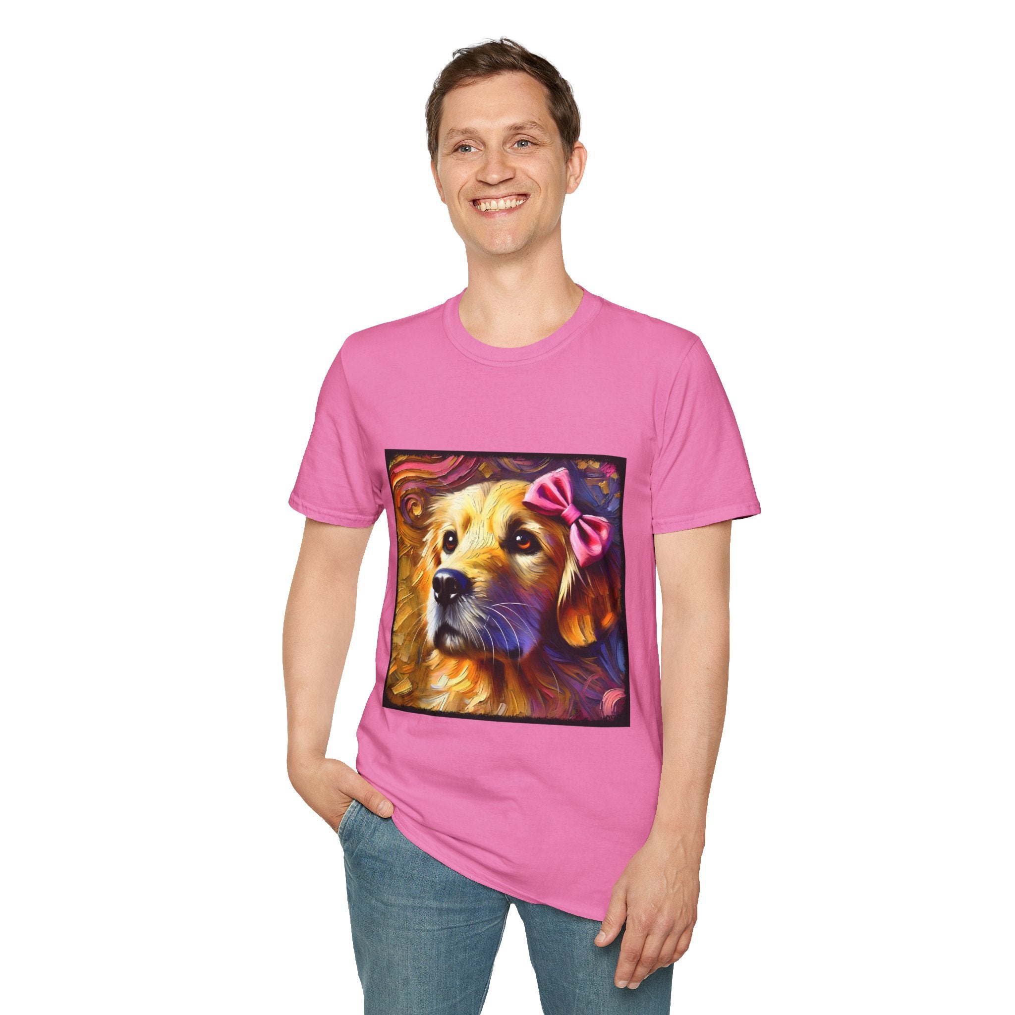 Male model in pink dog t-shirt featuring golden retriever with pink bow on head, set against vivid painterly swirls.