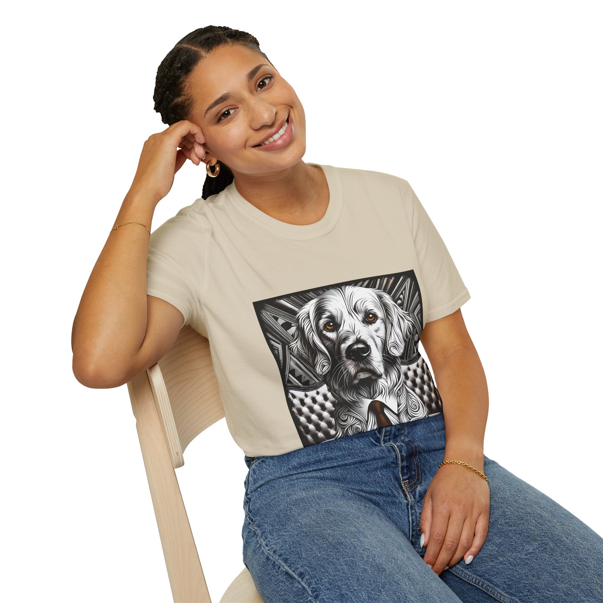 Female sitting in sand dog t-shirt featuring monochrome golden retriever with brown eyes and tie in front of settee.