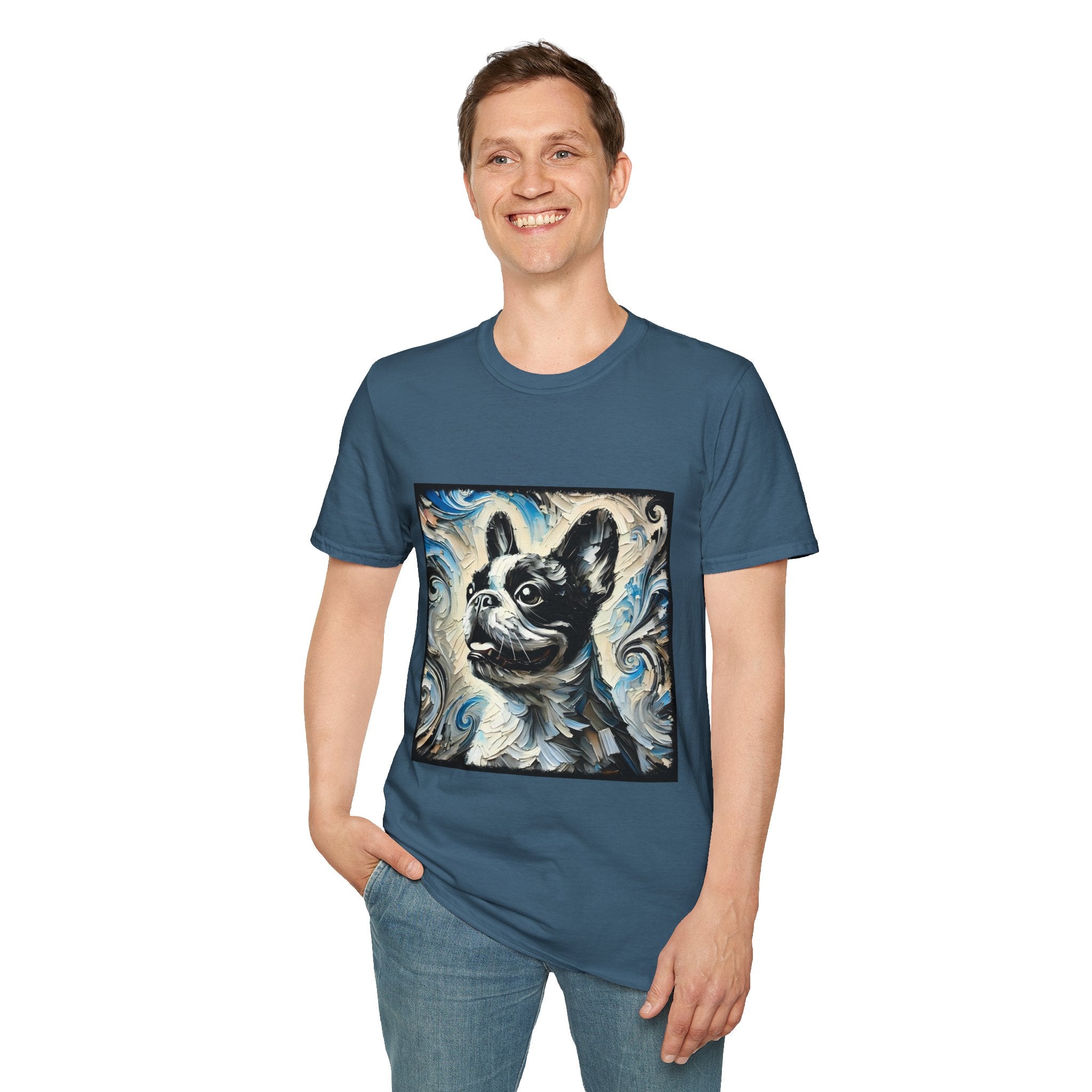 Man smiling in indigo blue dog t-shirt with black and white French Bulldog portrait on swirl-patterned vintage background.