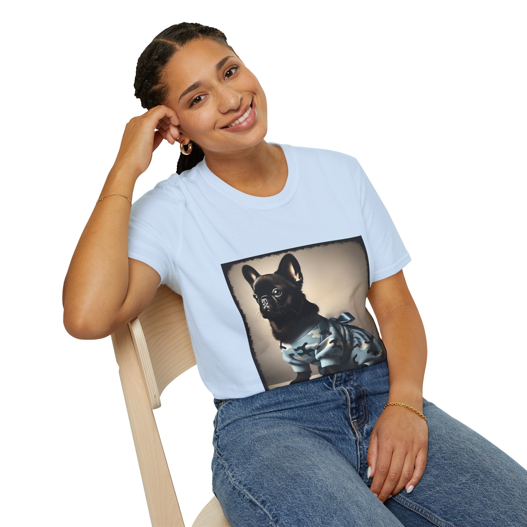 Woman sitting wearing light blue dog t-shirt featuring black French Bulldog in blue camo outfit with bow, set in soft vintage portrait.