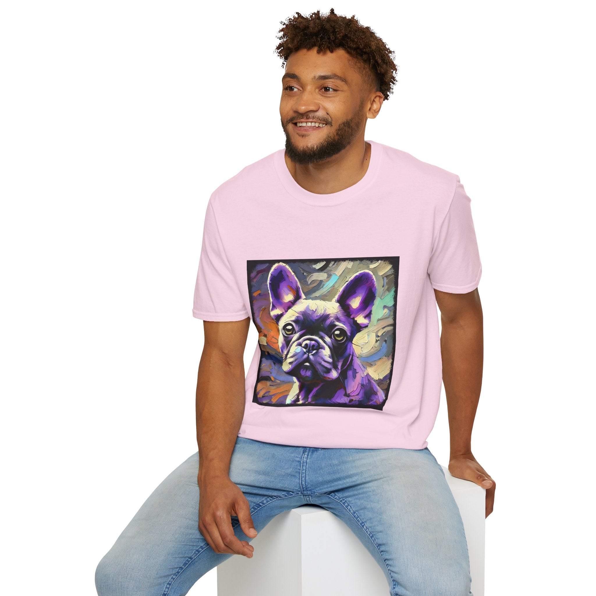 Male model in light pink dog t-shirt featuring a lavender purple French Bulldog with swirling brushstrokes of teal, orange, and cream.