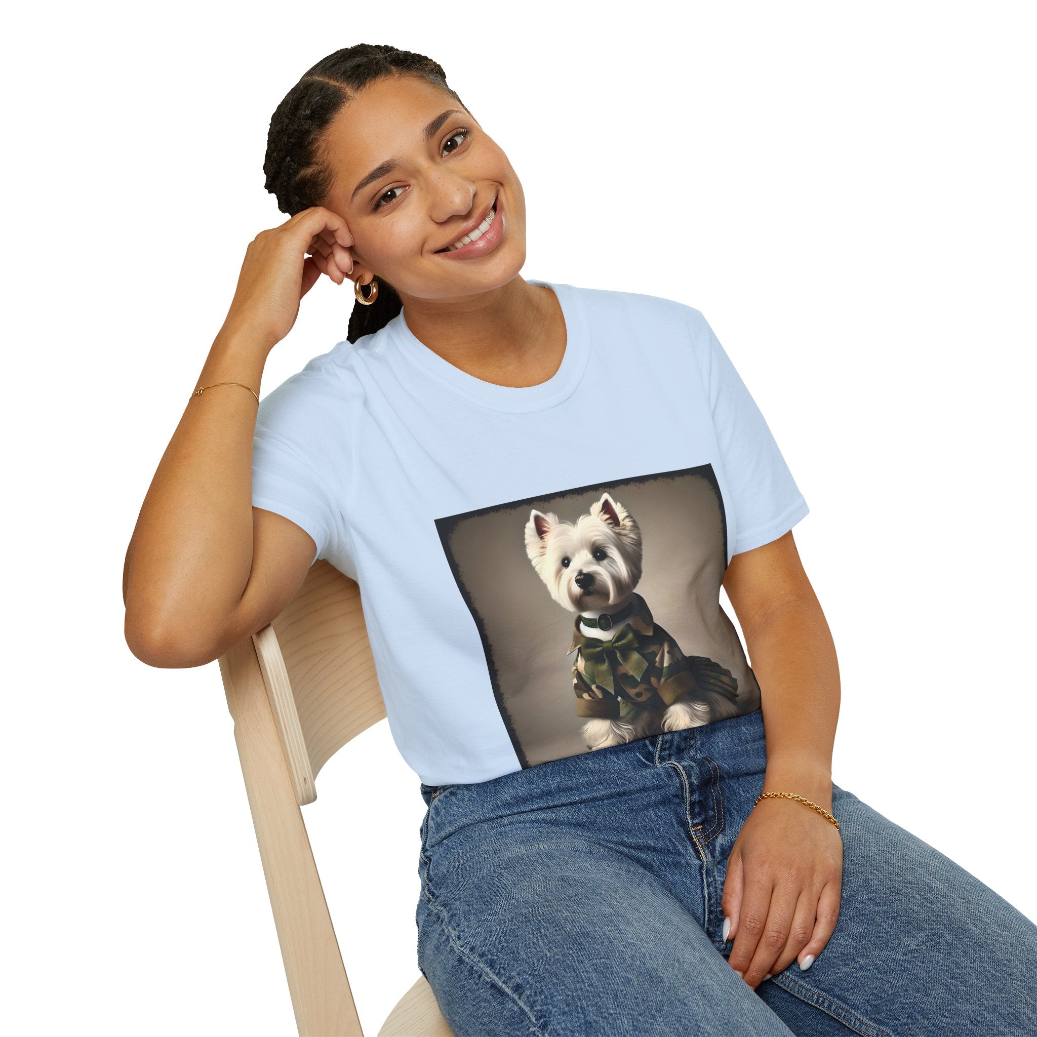 Female model in light blue dog t-shirt featuring Westie in camouflage jacket and pleated skirt against neutral backdrop.