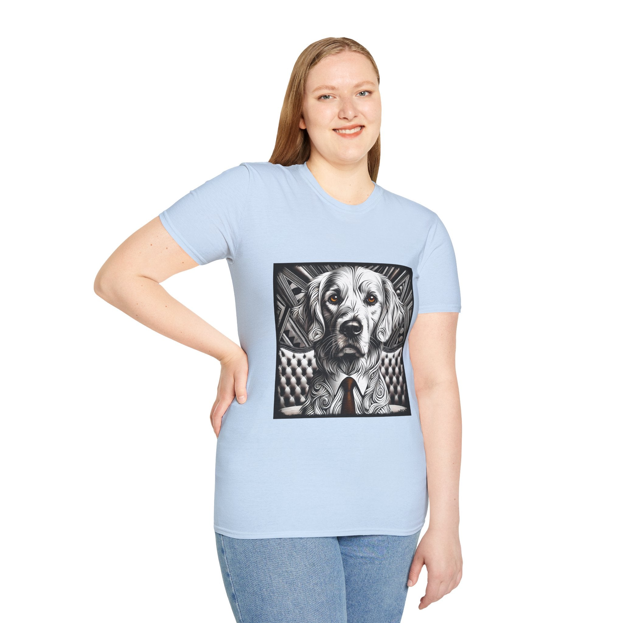 Female model in light blue dog t-shirt featuring monochrome golden retriever with brown eyes and tie in front of settee.