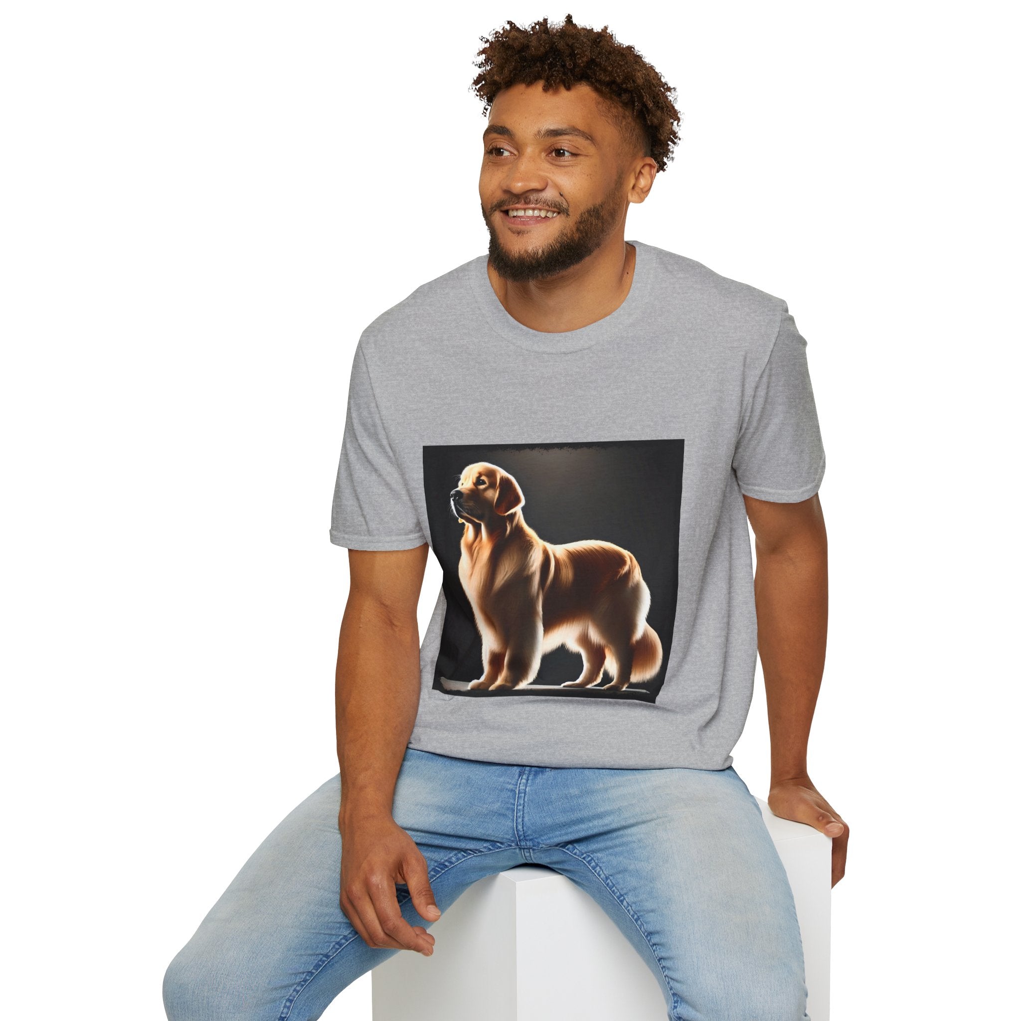 Male model in sport gray dog t-shirt with golden retriever standing tall under spotlight on black background.