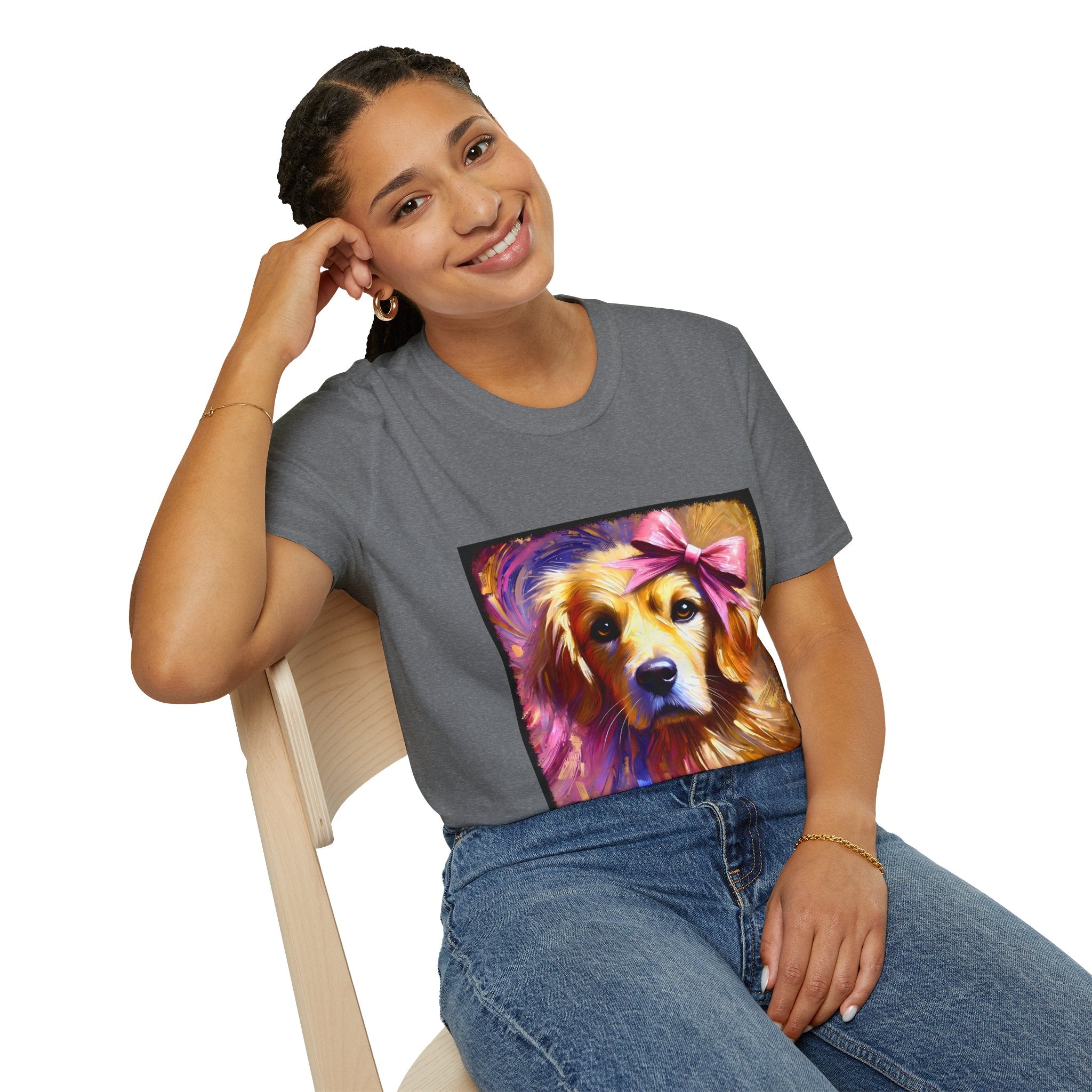 Female model in graphite heather dog t-shirt featuring golden retriever with pink bow on head, bold brushstroke background in pinks.