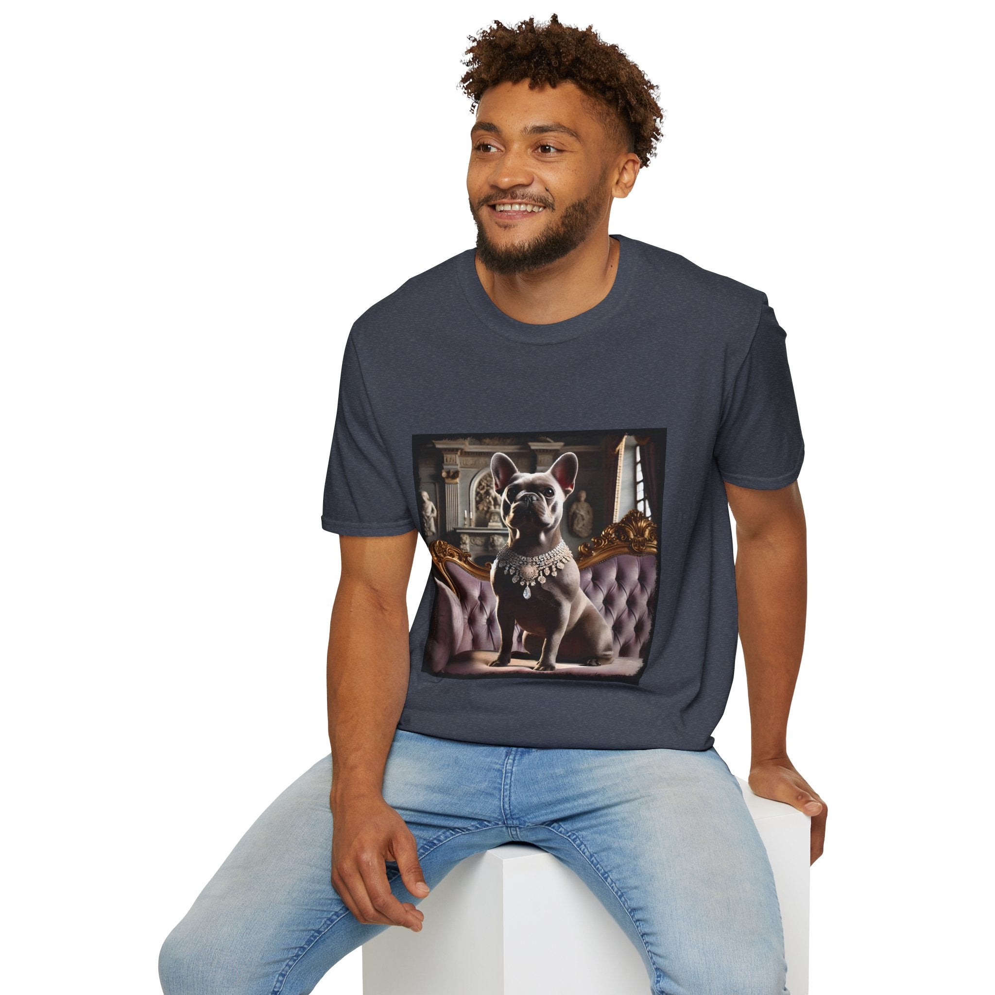 Male model in heather navy dog t-shirt featuring gray French Bulldog in jeweled necklace on tufted settee in palace setting.