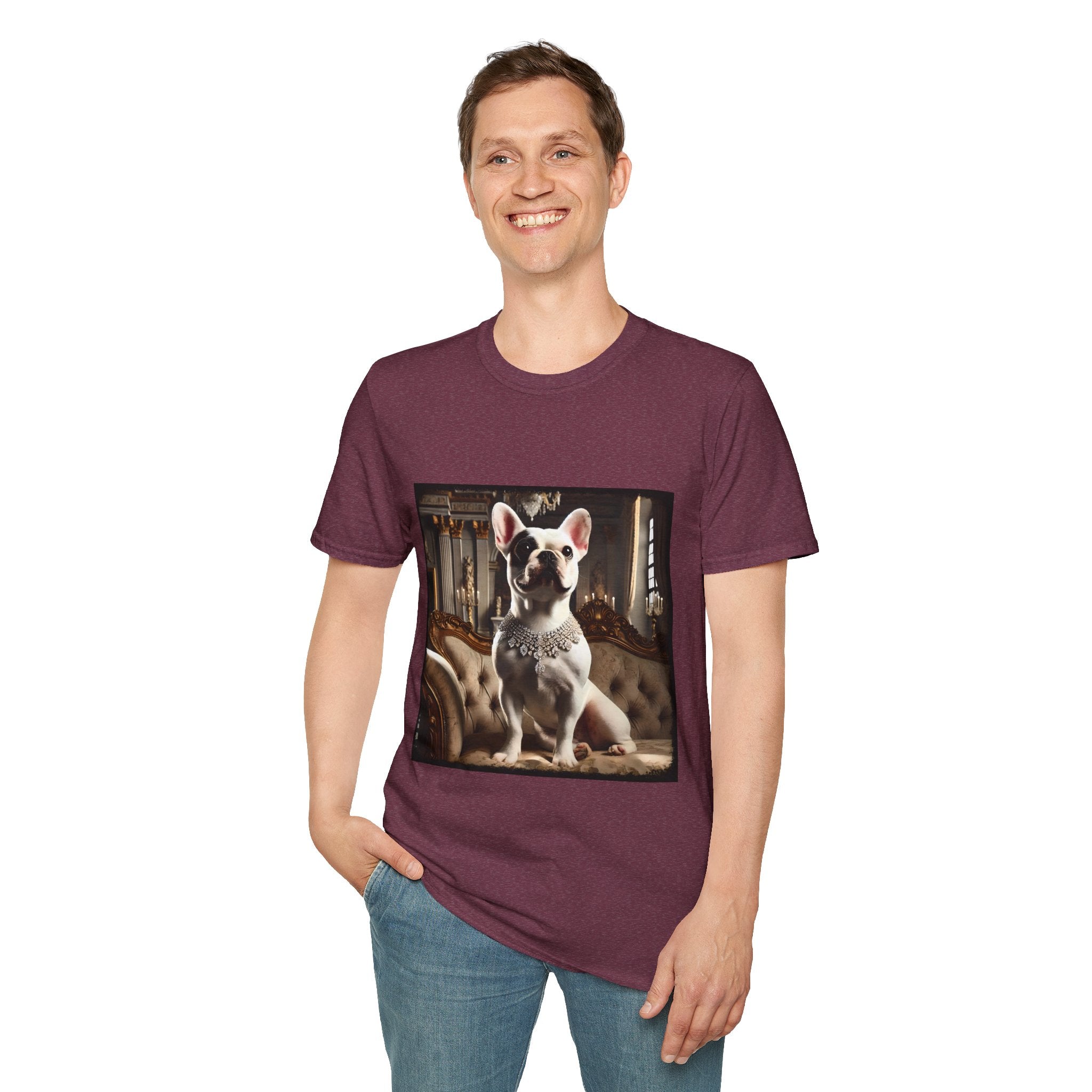 Man smiling in heather maroon dog t-shirt featuring white French Bulldog in jeweled necklace on tufted settee in elegant palace setting.