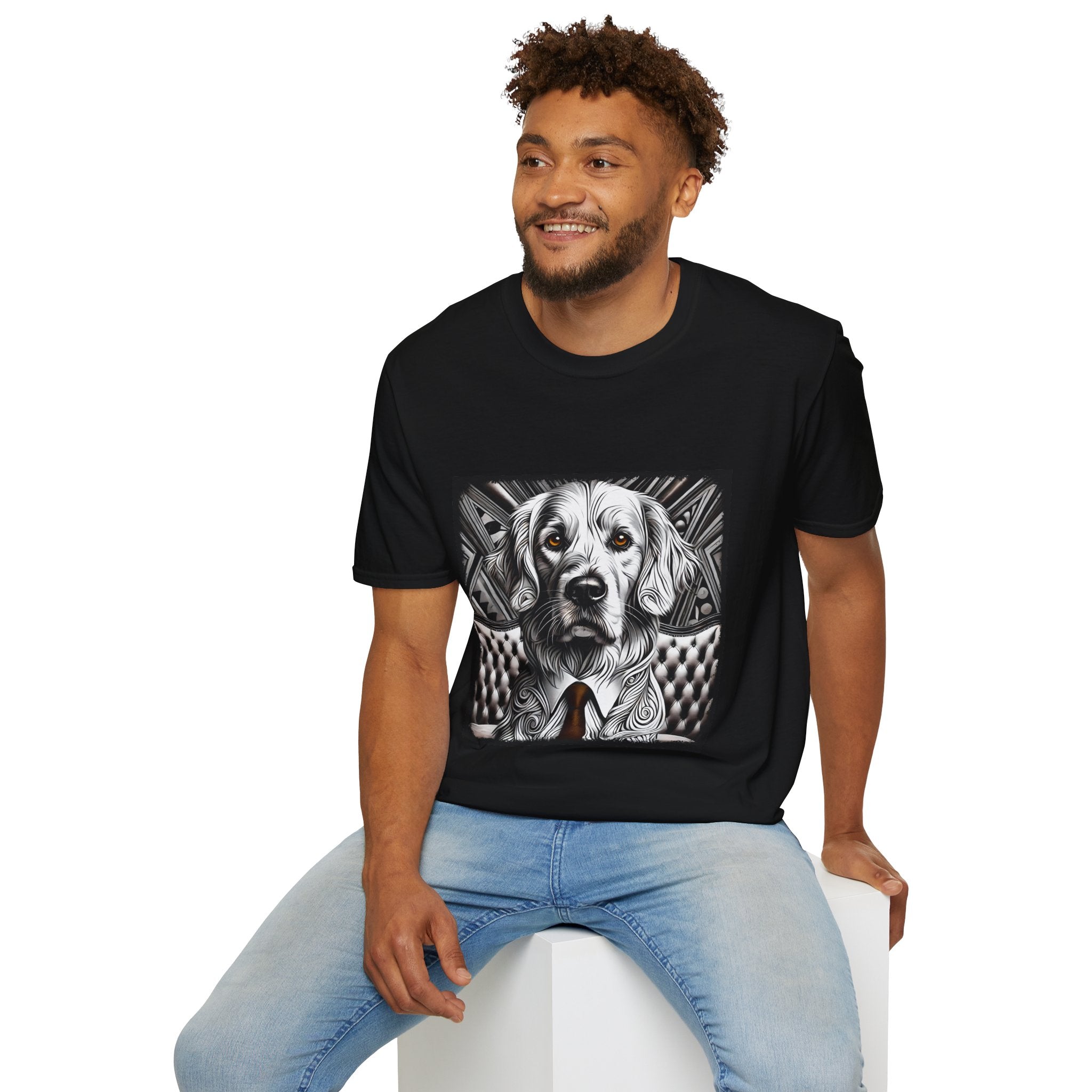 Male model in black dog t-shirt featuring monochrome golden retriever with brown eyes and tie in front of settee.