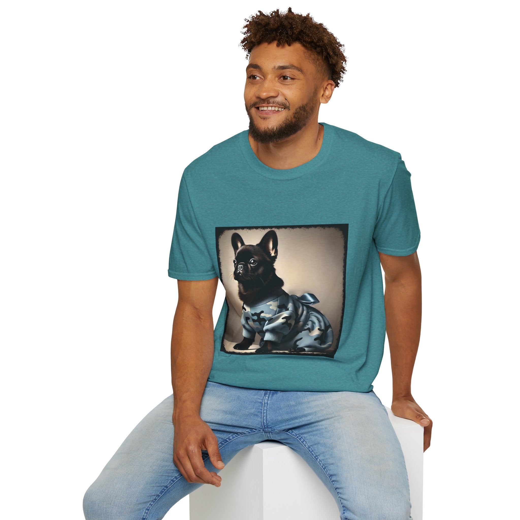 Male model wearing teal dog t-shirt featuring black French Bulldog in blue camo outfit with bow, set in soft vintage portrait.