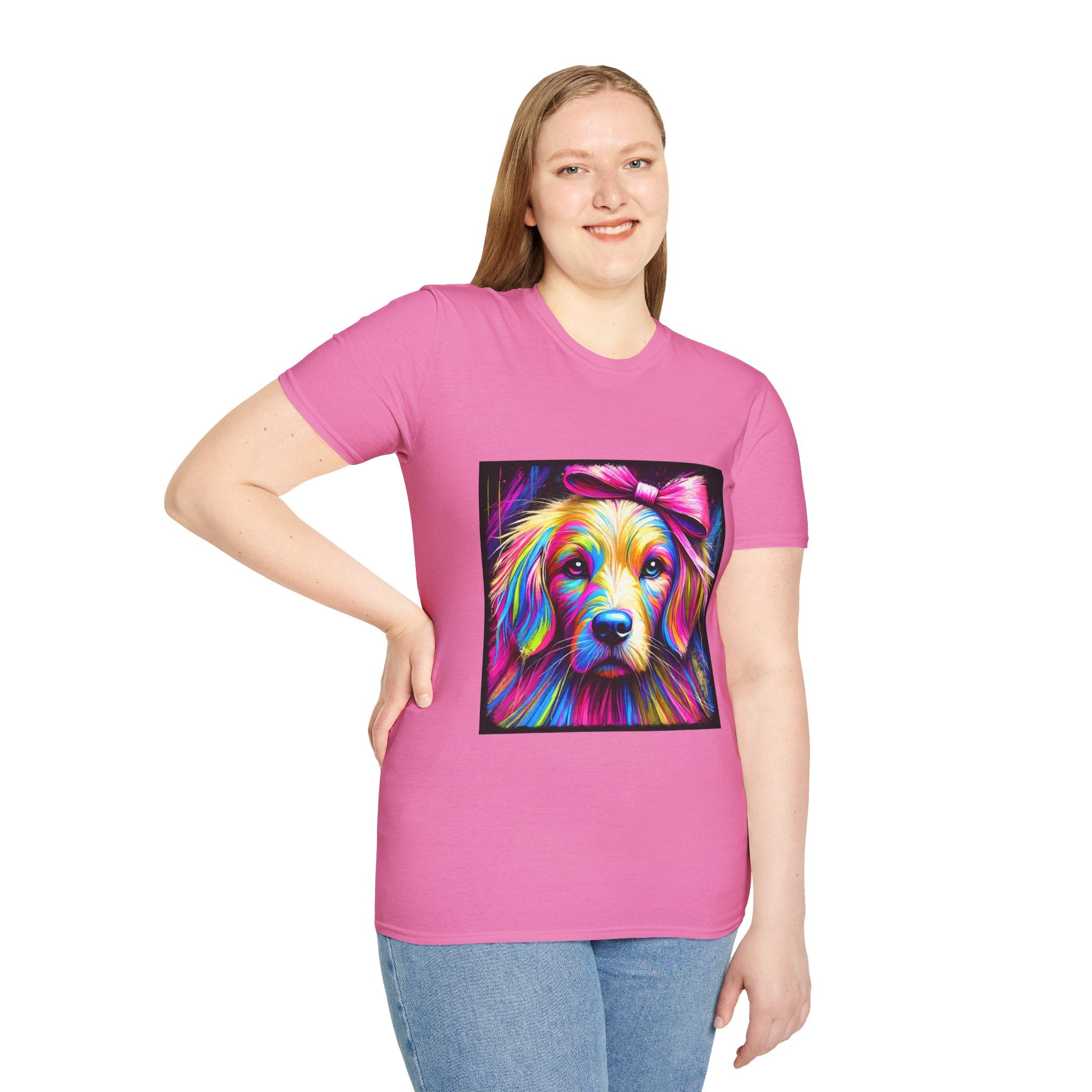 Female model in pink dog t-shirt featuring neon-colored golden retriever with pink bow on vibrant electric abstract backdrop.