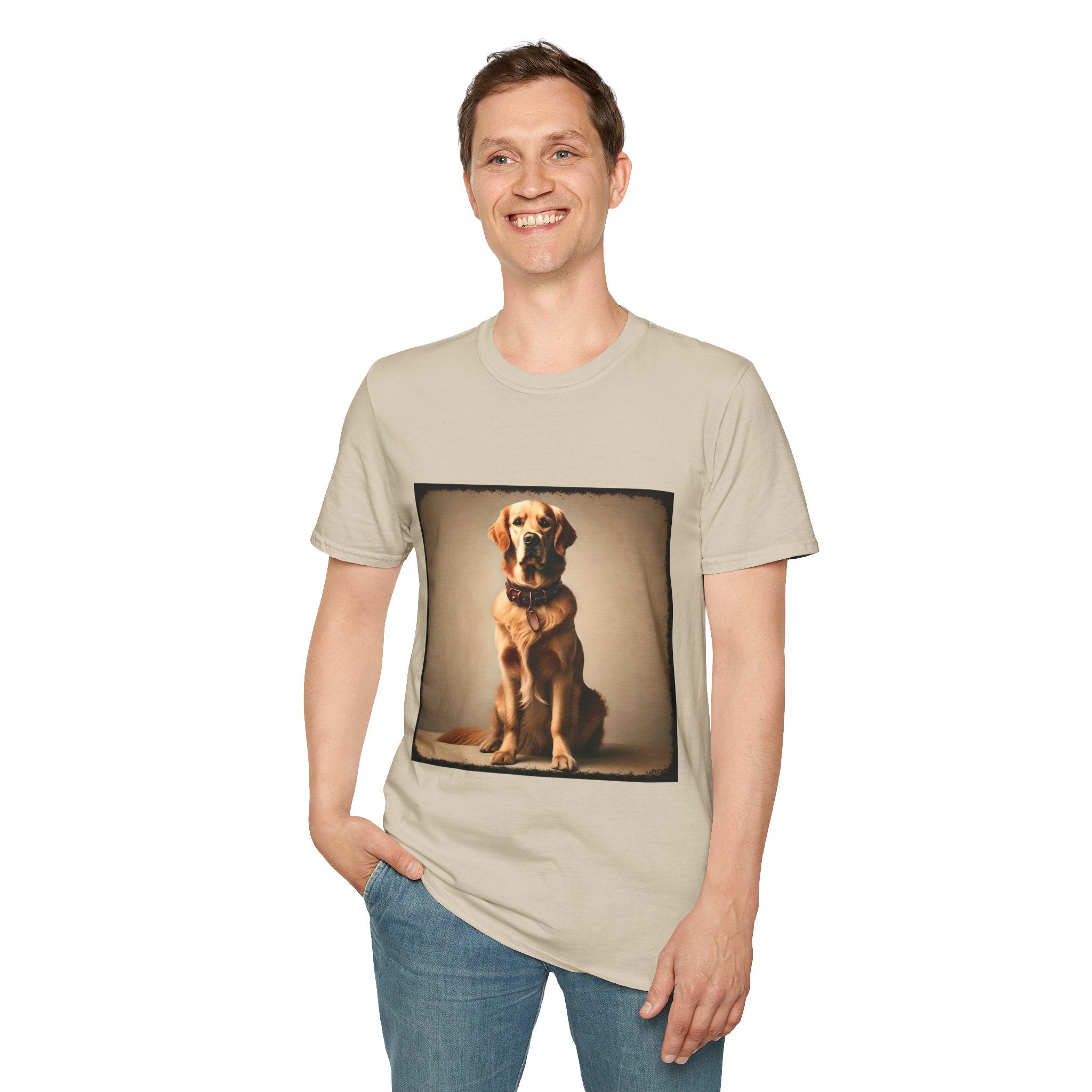 Male model in sand dog t-shirt featuring golden retriever in brown collar, seated against a neutral tan backdrop.